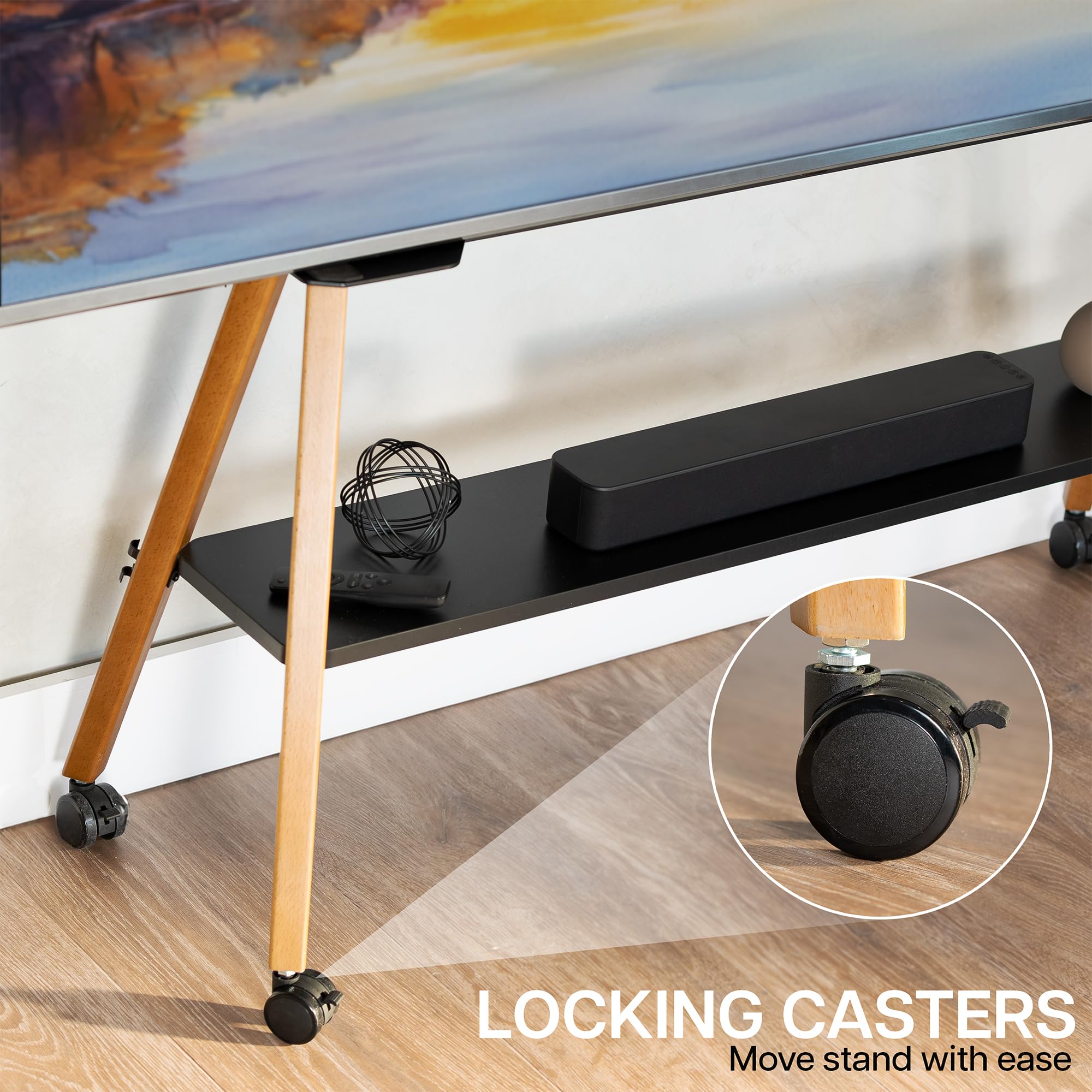 TV Stand with wheels and a soundbar on it's shelf, on a wooden floor, emphasizing locking casters which allow you to move and position the stand with ease.