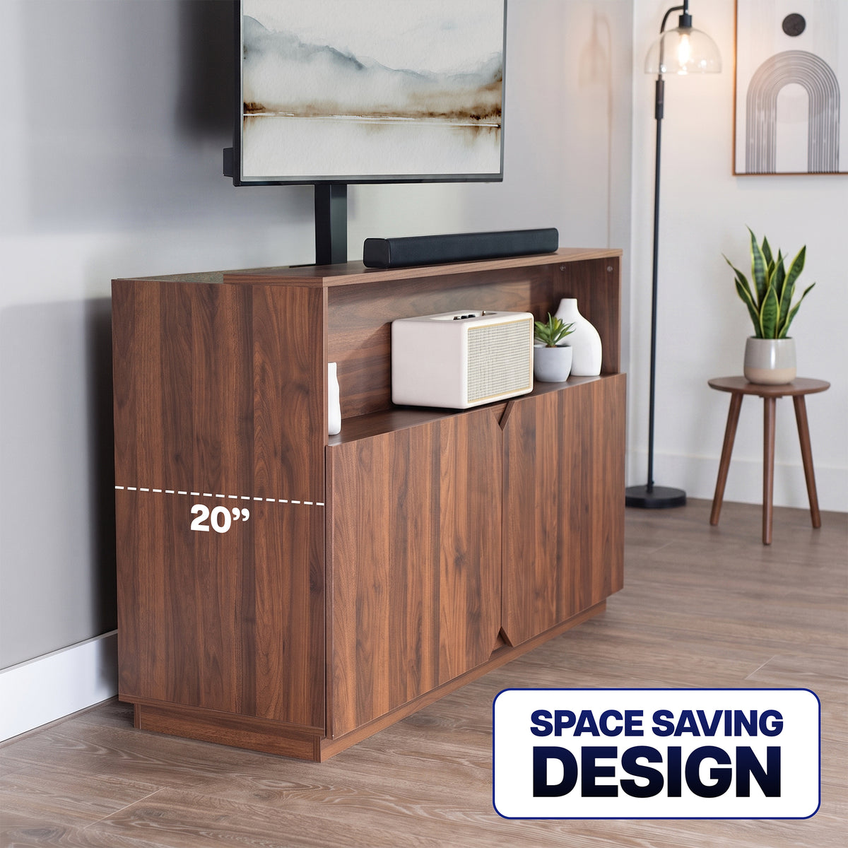 A walnut-finish wooden media console with a TV and soundbar on top, shown in a styled room. A dashed line indicates a 20-inch height, and a badge in the corner reads 'SPACE SAVING DESIGN'.