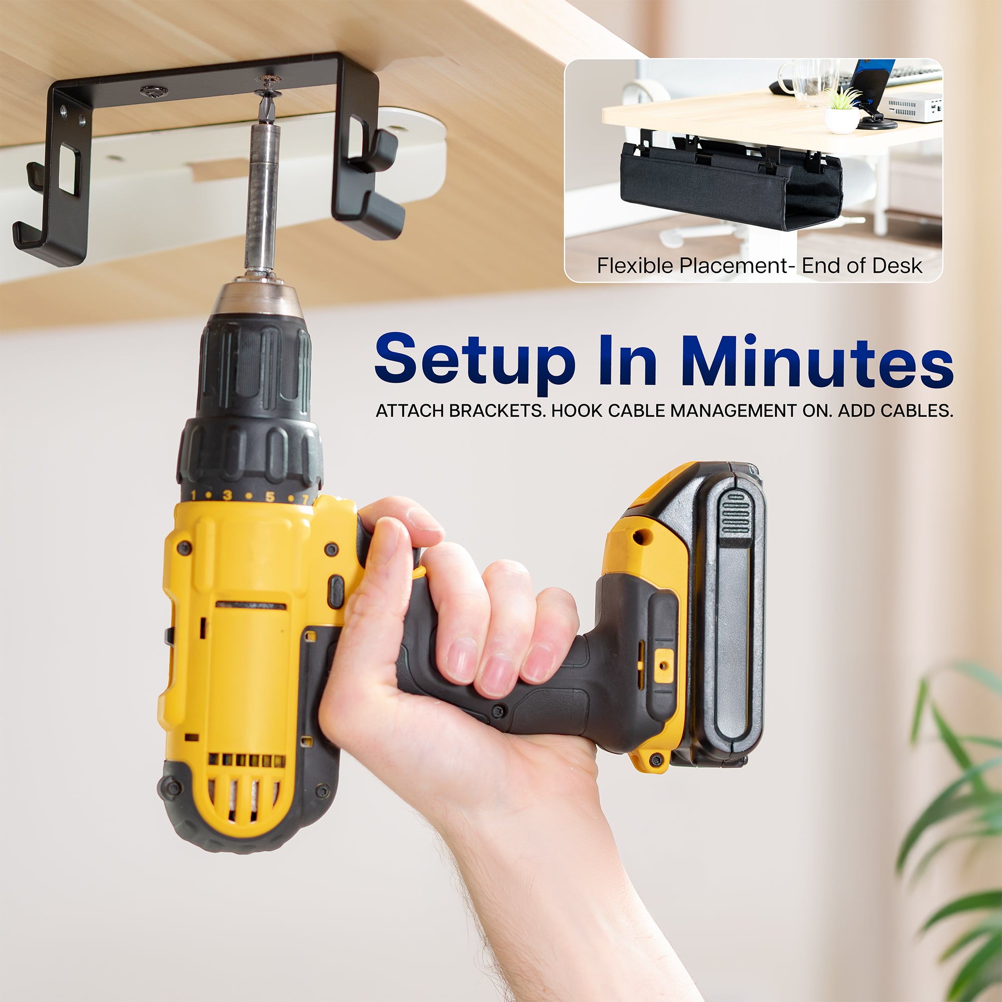 Hand holding a yellow cordless drill with bracket attachment on a white background
