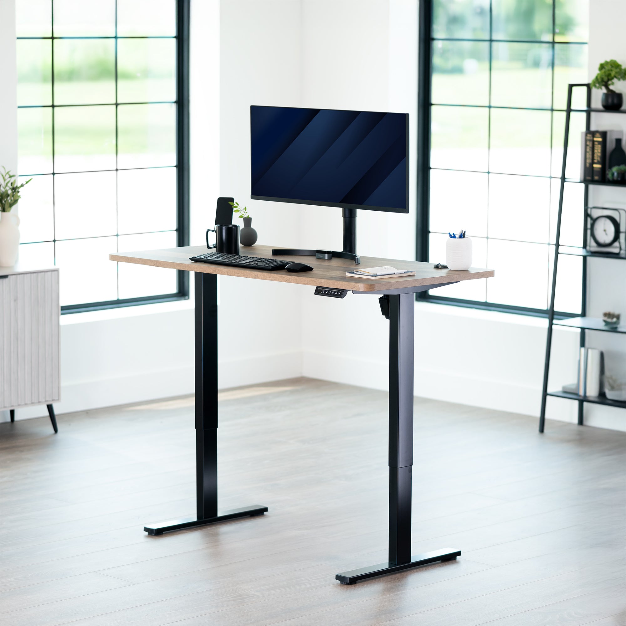 Sturdy ergonomic sit or stand active desk workstation with adjustable height using smart control panel.