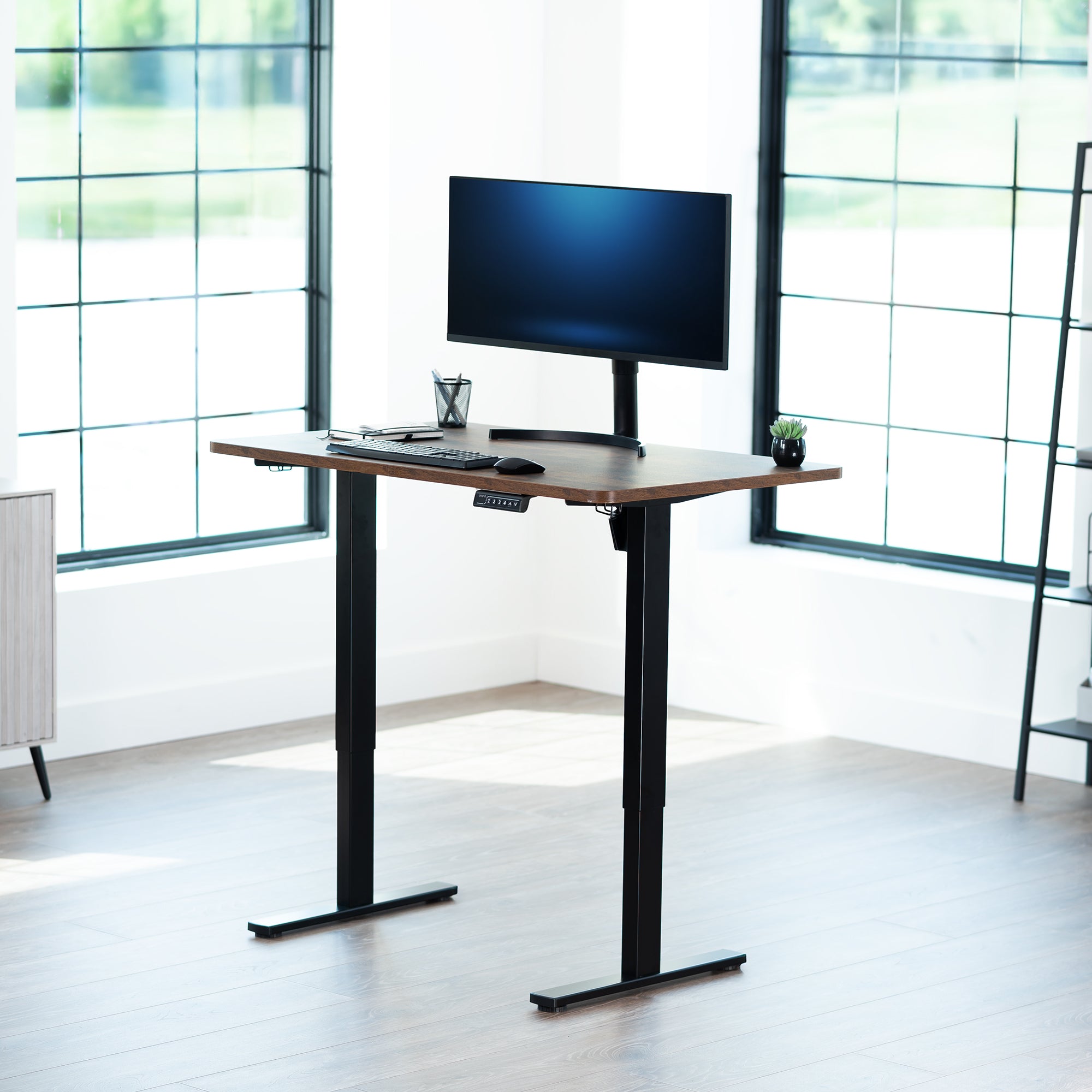 Sturdy ergonomic sit or stand active desk workstation with adjustable height using smart control panel.