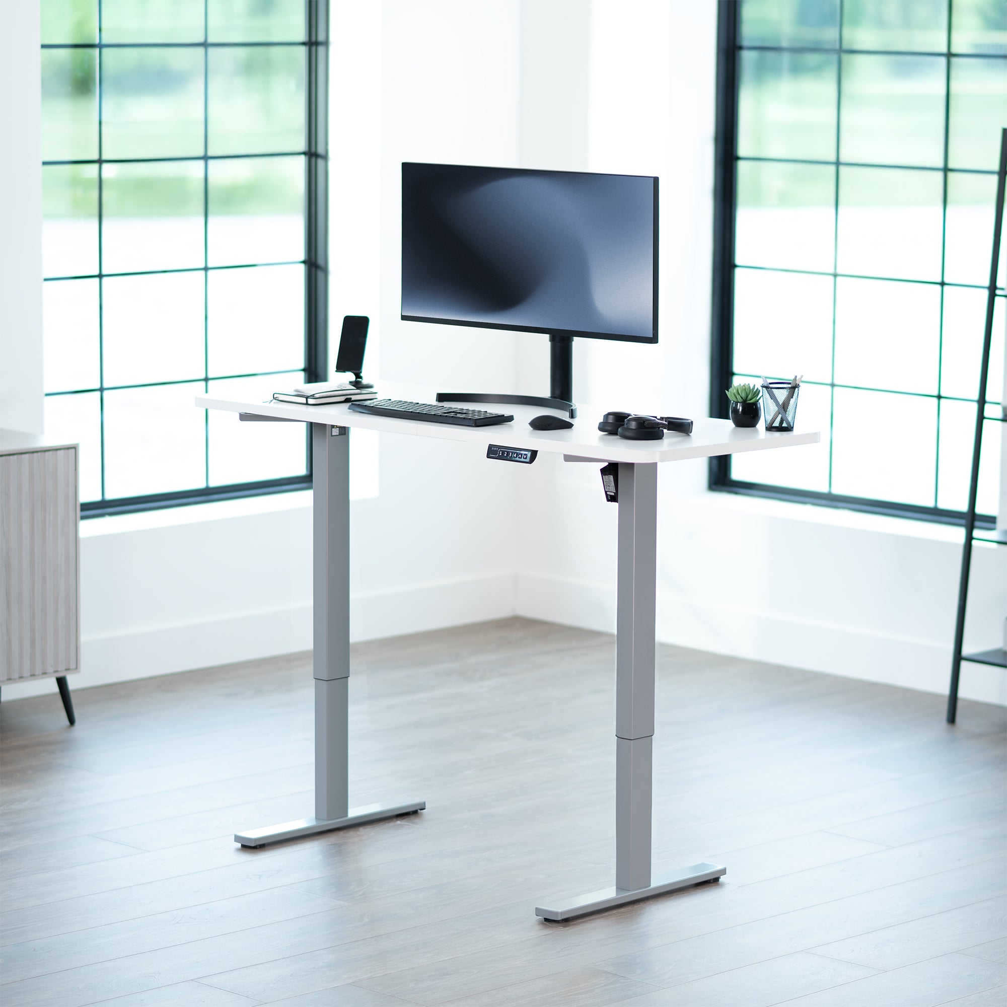 Sturdy ergonomic sit or stand active desk workstation with adjustable height using smart control panel.