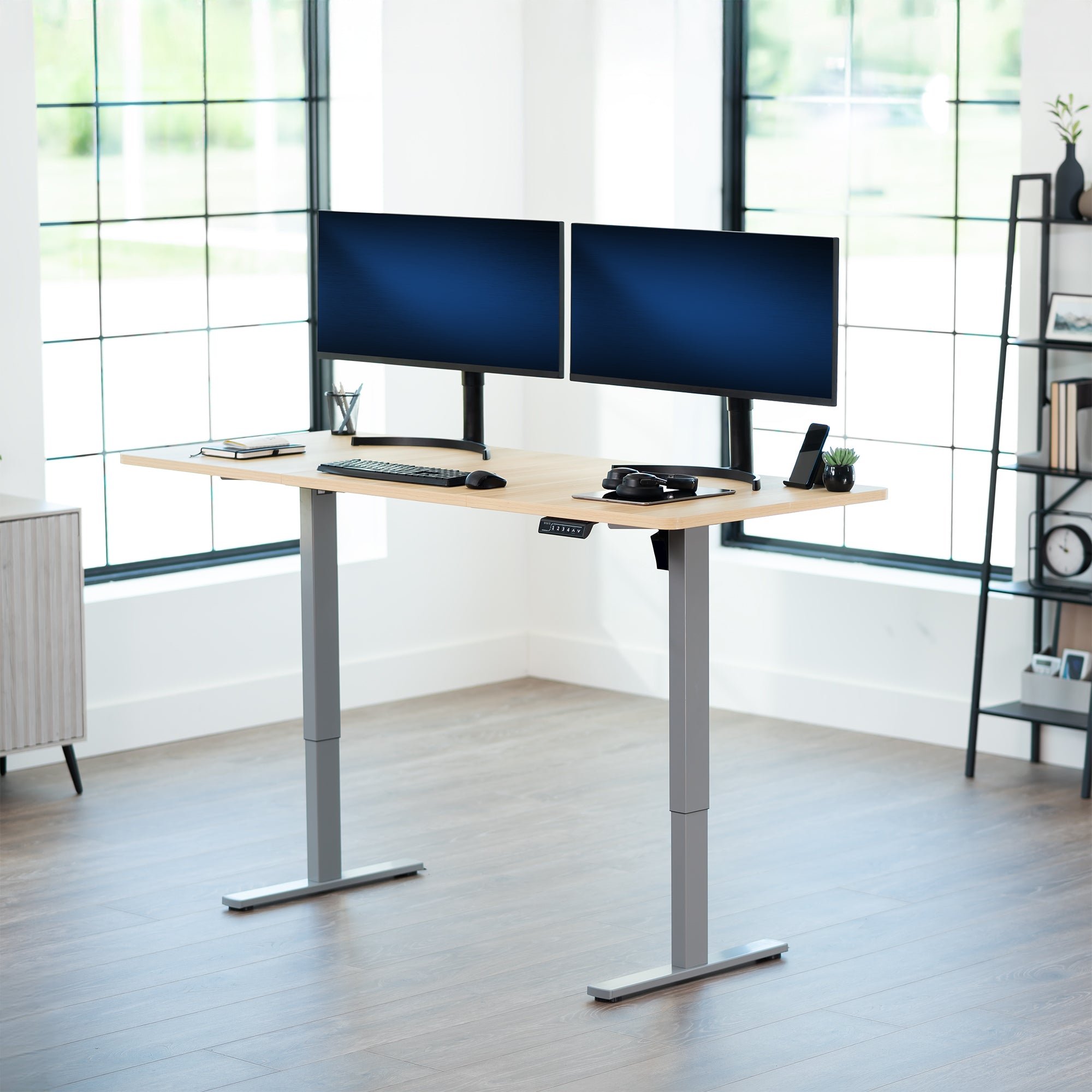 Large sturdy sit or stand modern desk with electric height adjustment options.