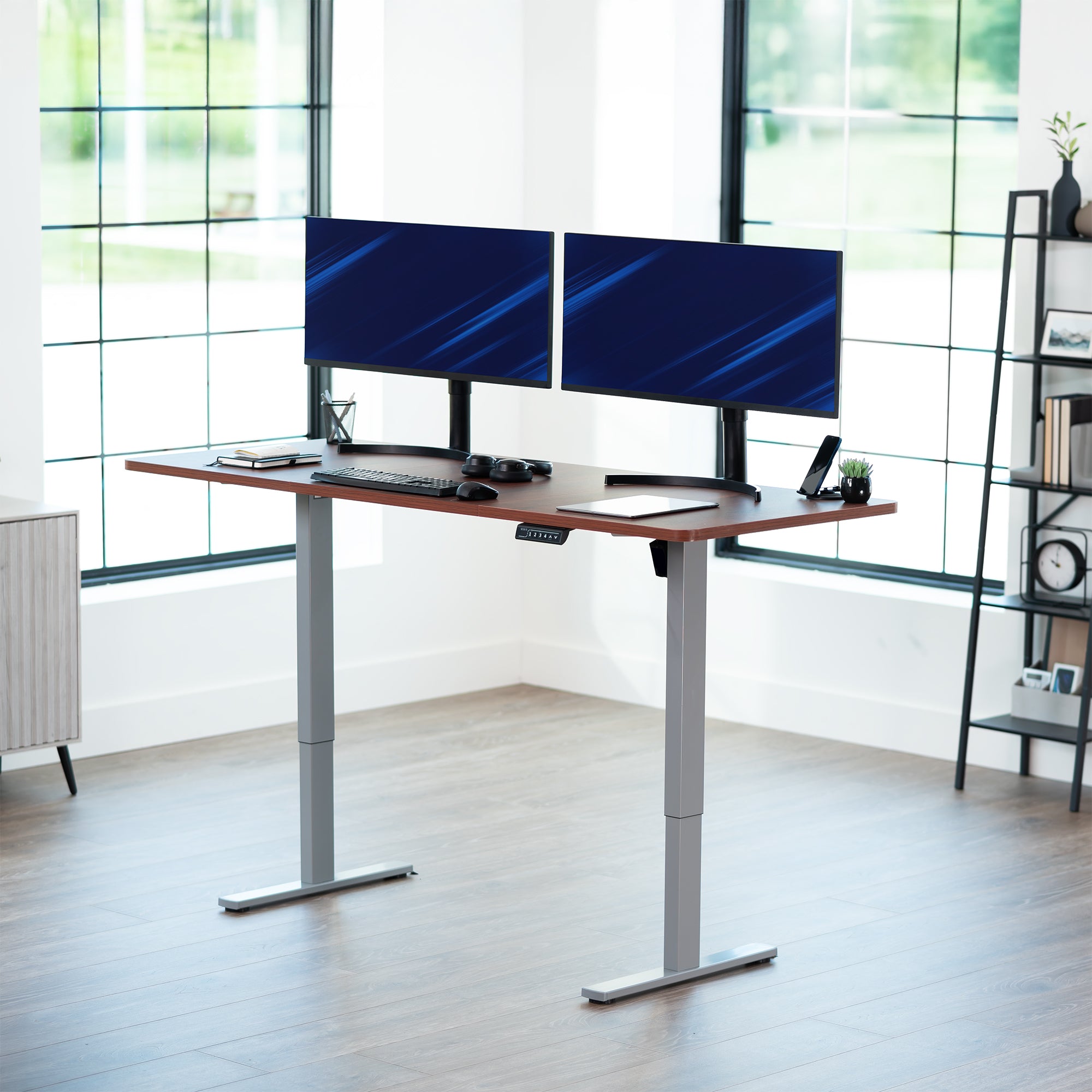 Large sturdy sit or stand modern desk with electric height adjustment options.