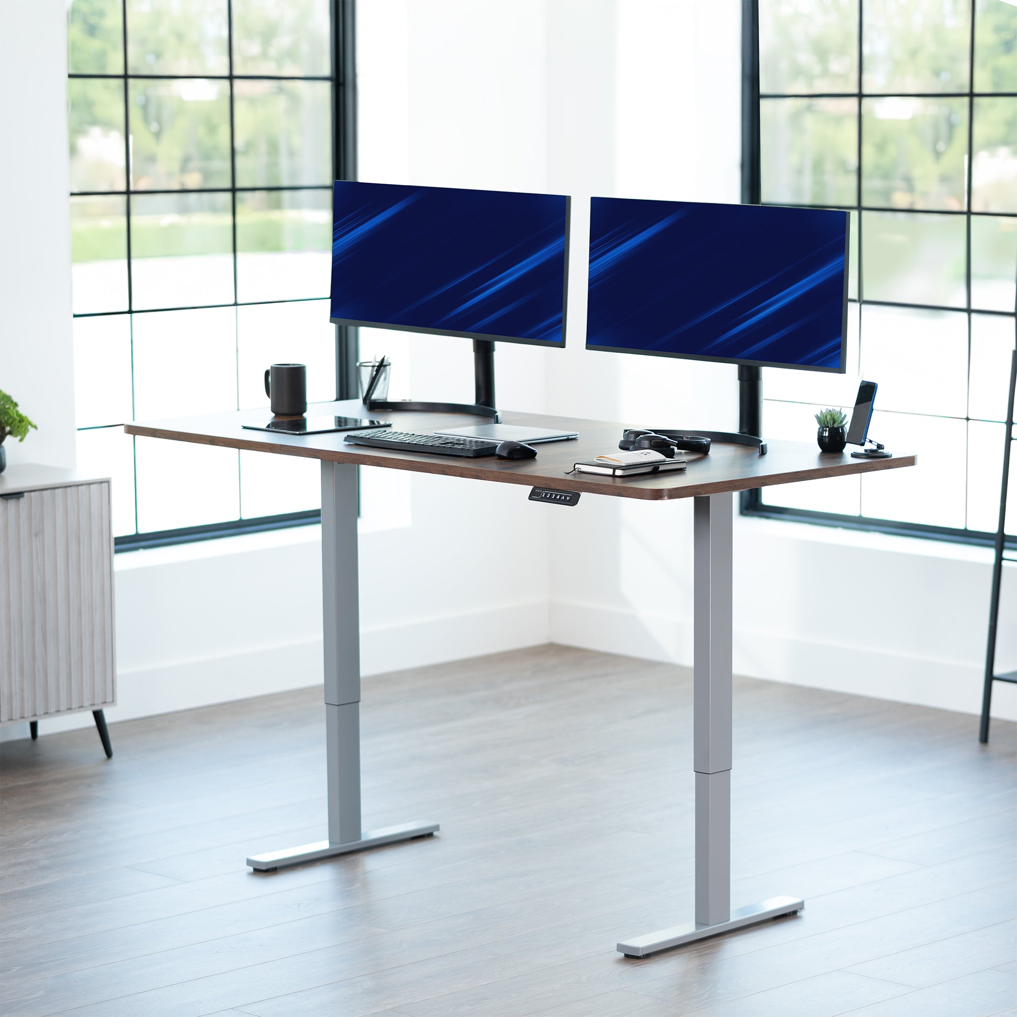 Large sturdy sit or stand modern desk with electric height adjustment options.