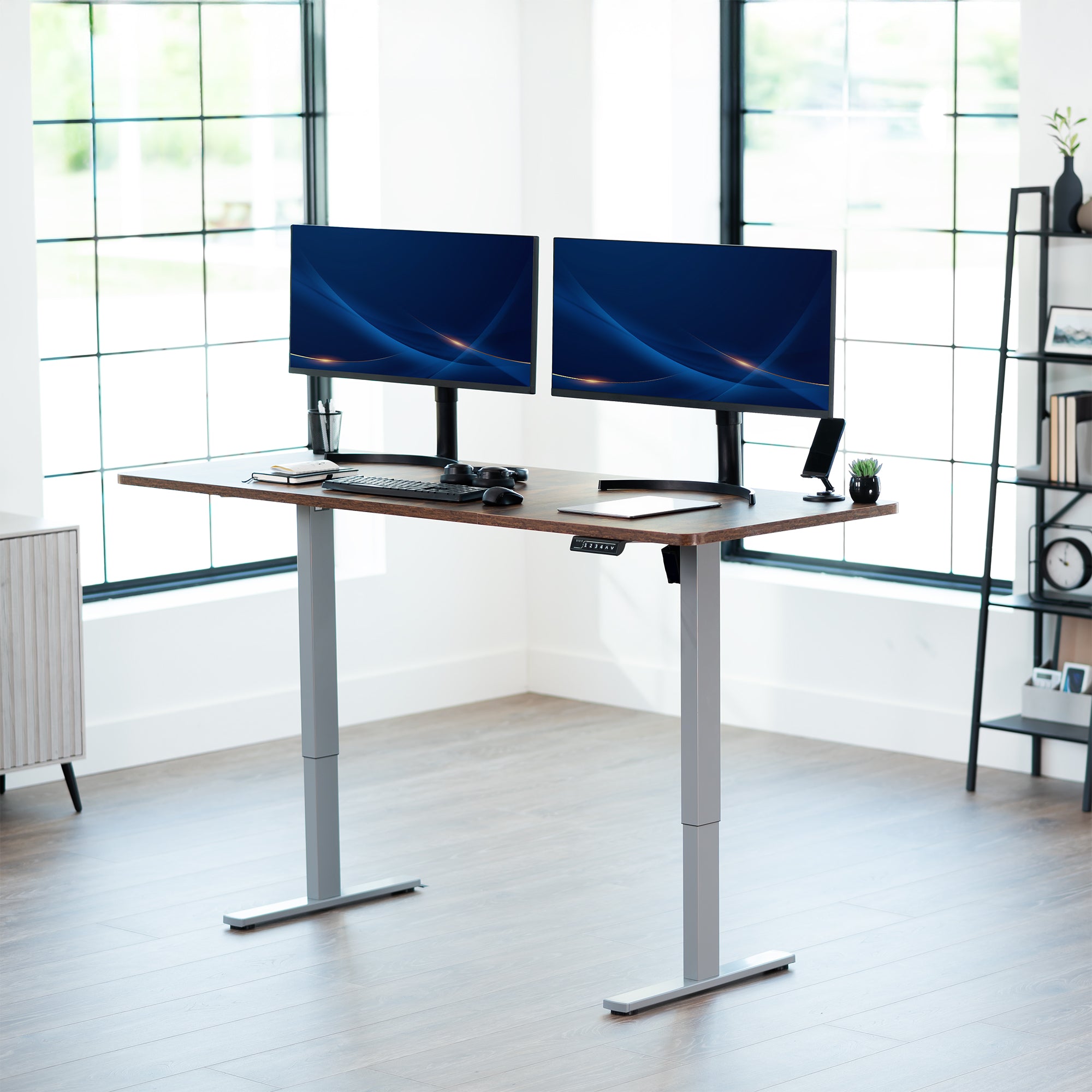 Large sturdy sit or stand modern desk with electric height adjustment options.