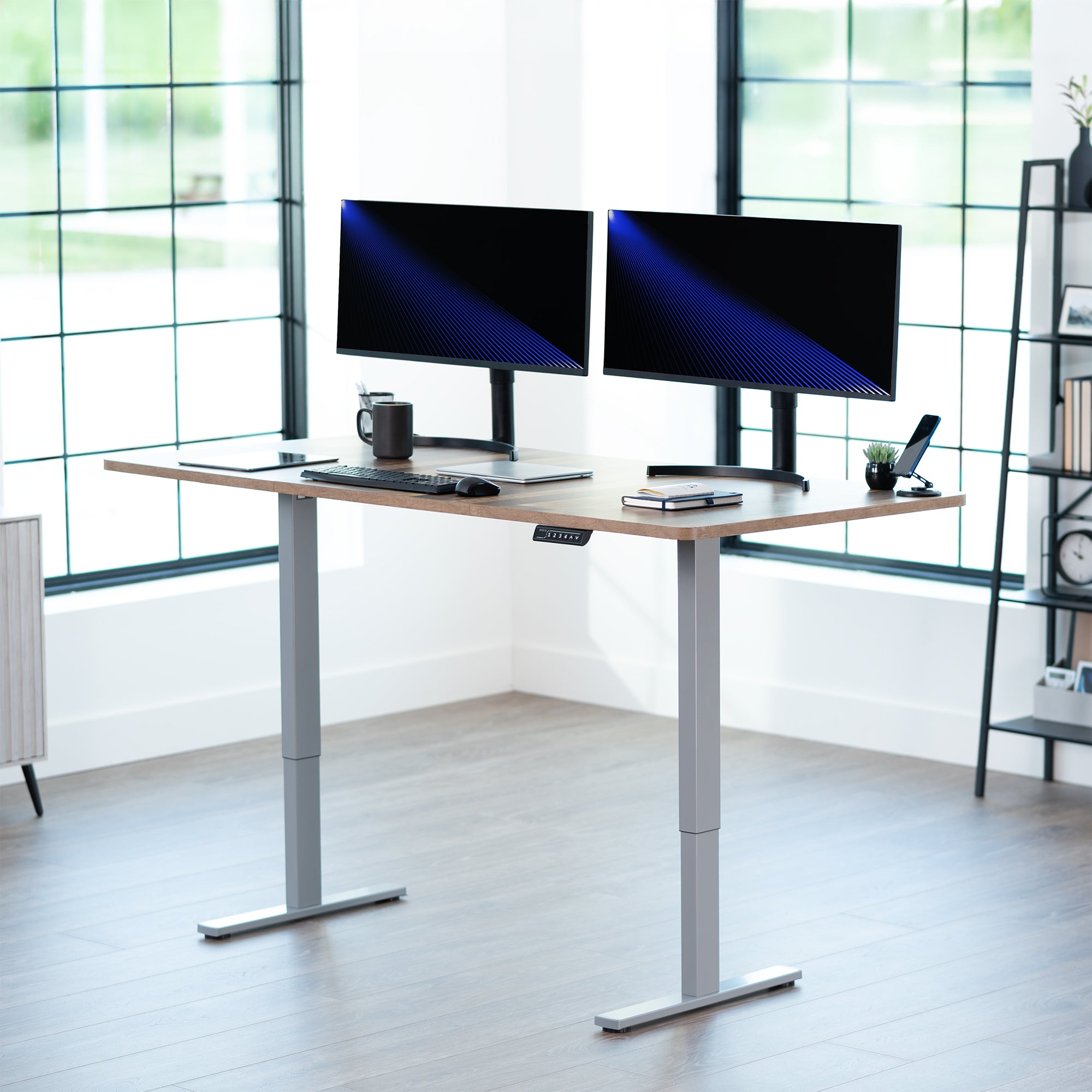 Large sturdy sit or stand modern desk with electric height adjustment options.