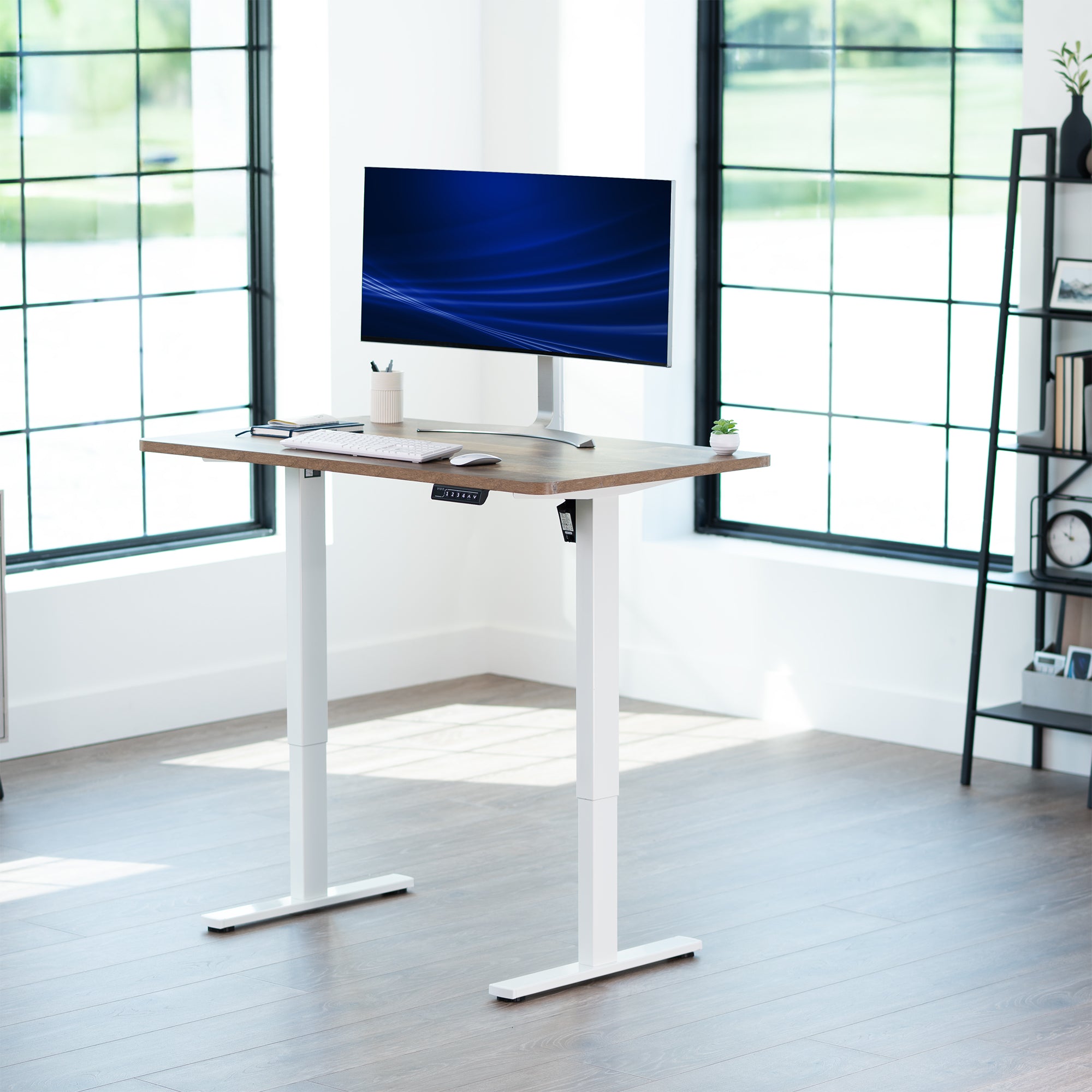 Sturdy ergonomic sit or stand active desk workstation with adjustable height using smart control panel.