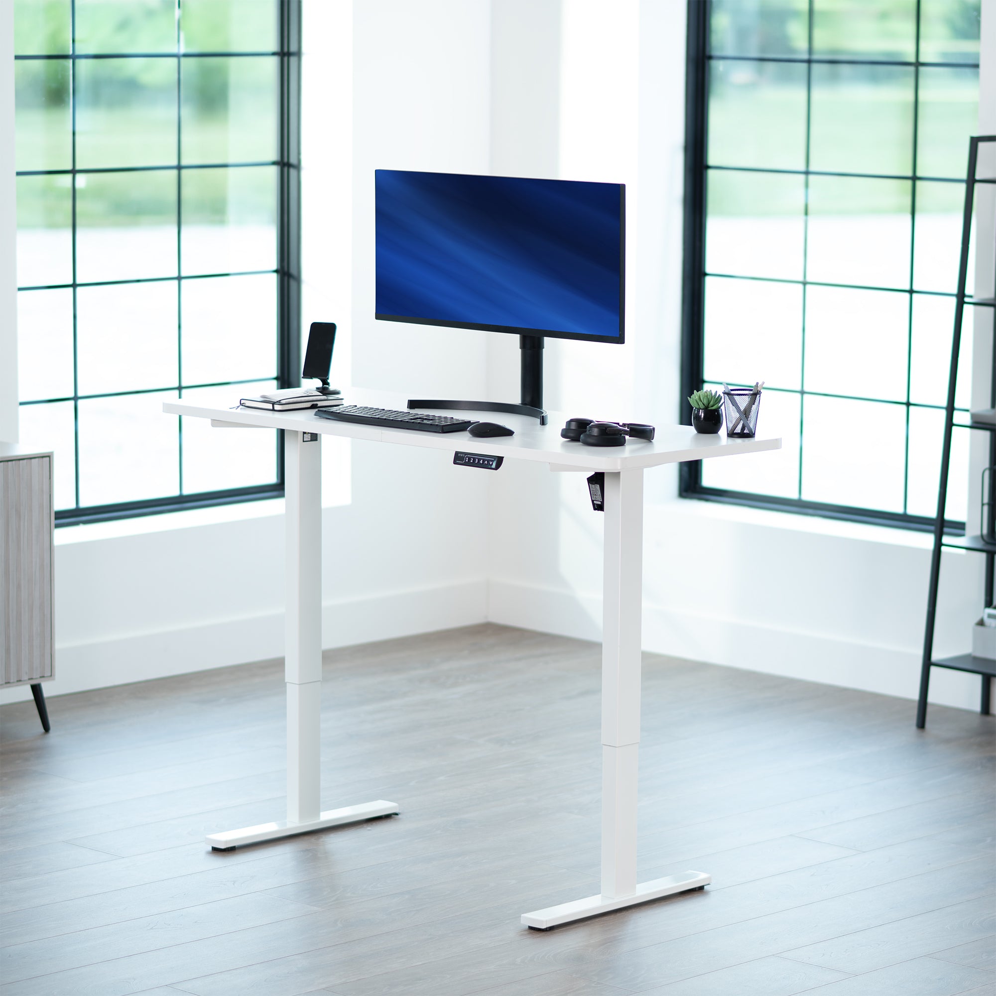 Sturdy ergonomic sit or stand active desk workstation with adjustable height using smart control panel.