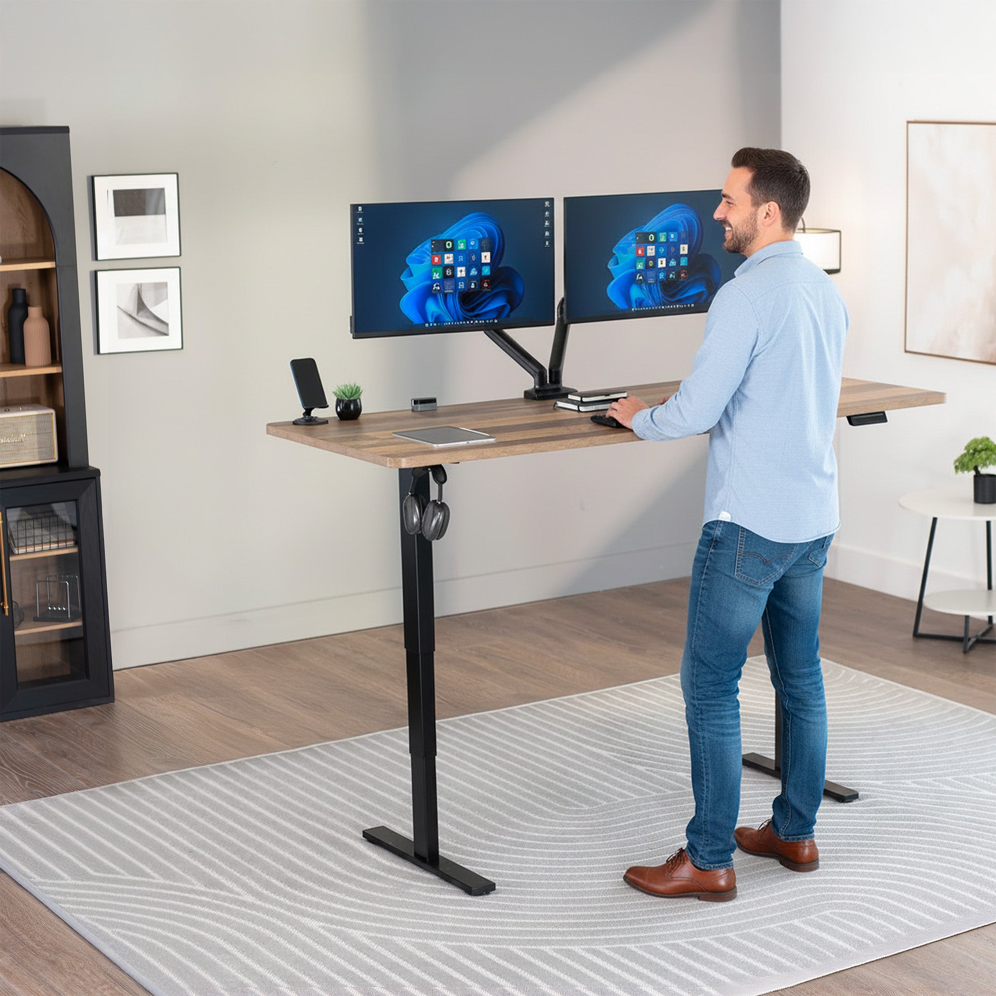 Heavy-duty electric height adjustable desktop workstation for active sit or stand efficient workspace.