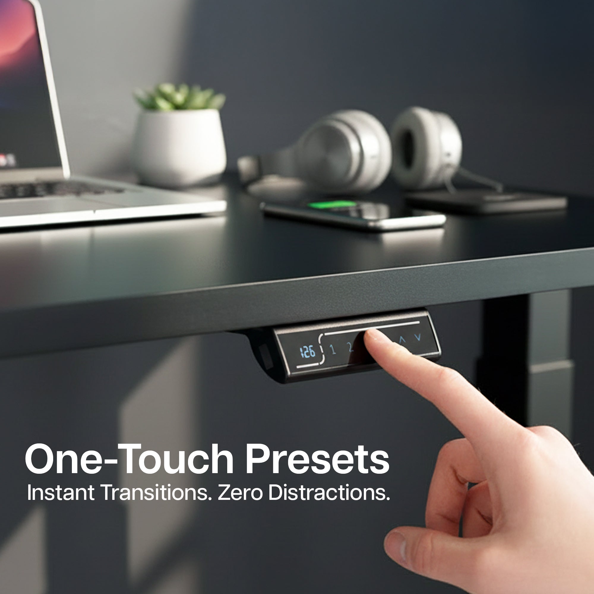 Close-up image of someone using the touch screen controller on the 2E Series - 83" x 30" Electric Desk