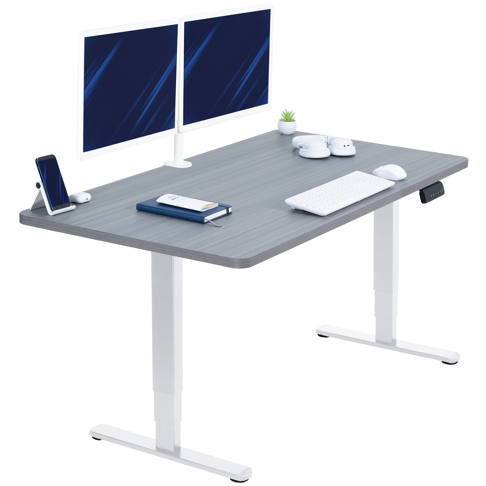 Gray desk with white legs, two monitors, a phone, and other office items on a white background