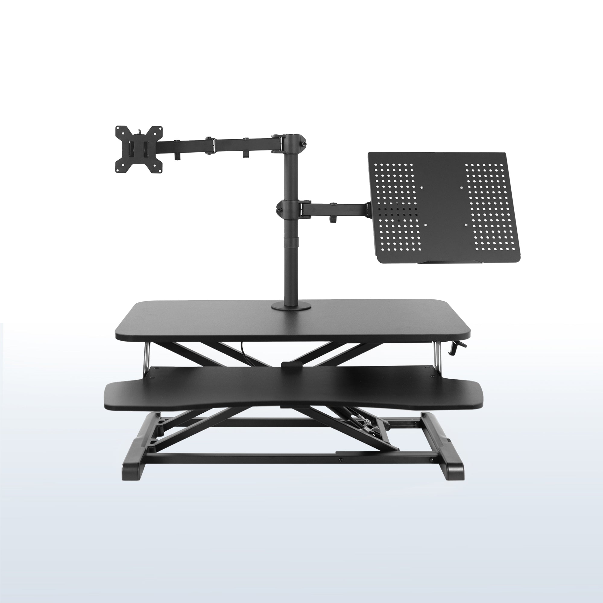 Sit to stand desk riser with built-in monitor mount and laptop mount.