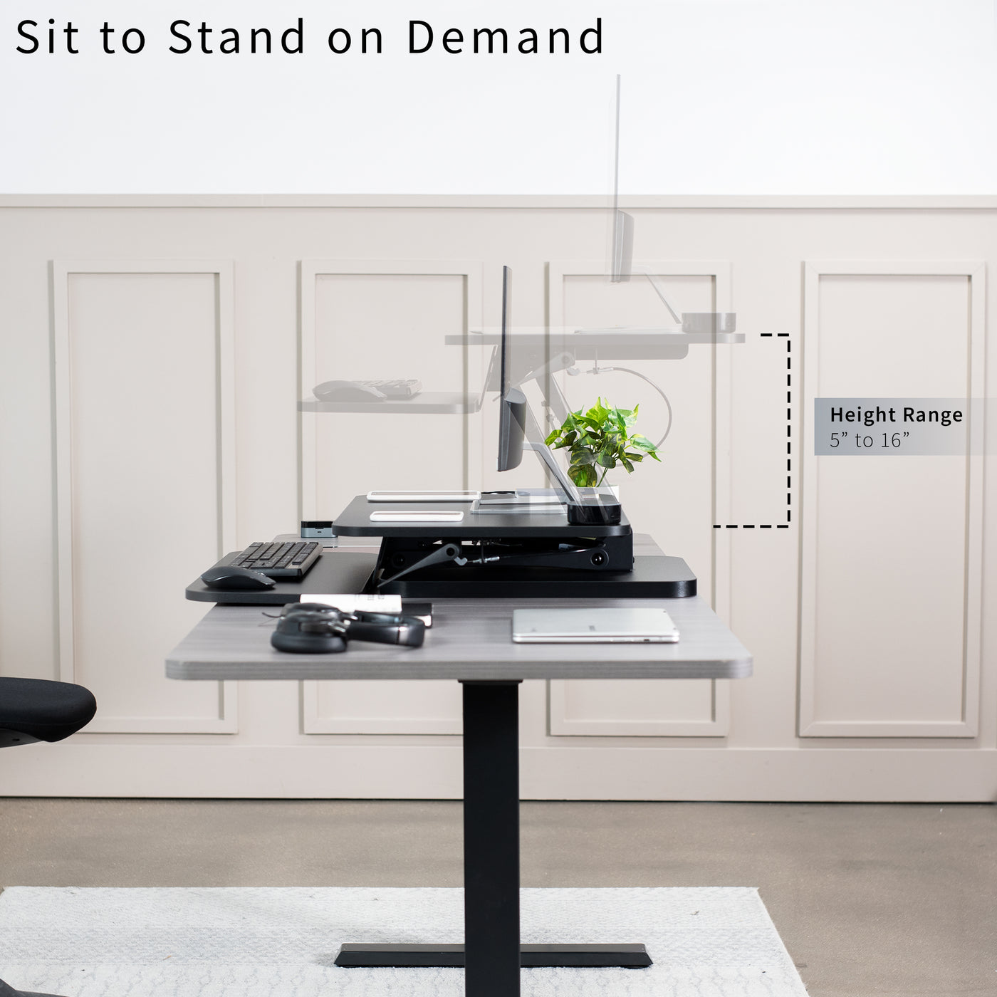 Sit stand desk converter sits on top of current desk and raises and lowers for a comfortable viewing and typing experience.