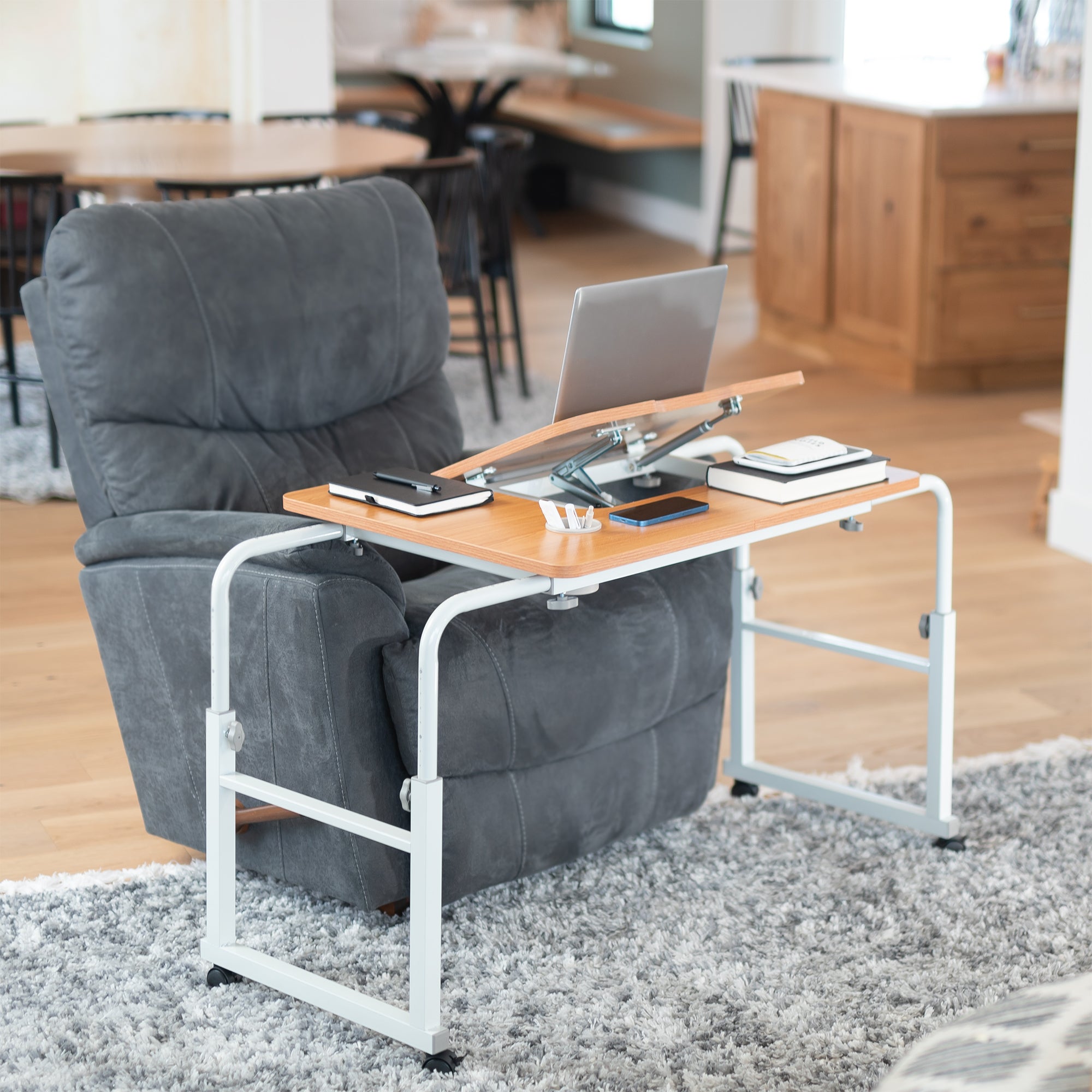 Gray recliner chair with a wooden desk, in a home office or living room scene.