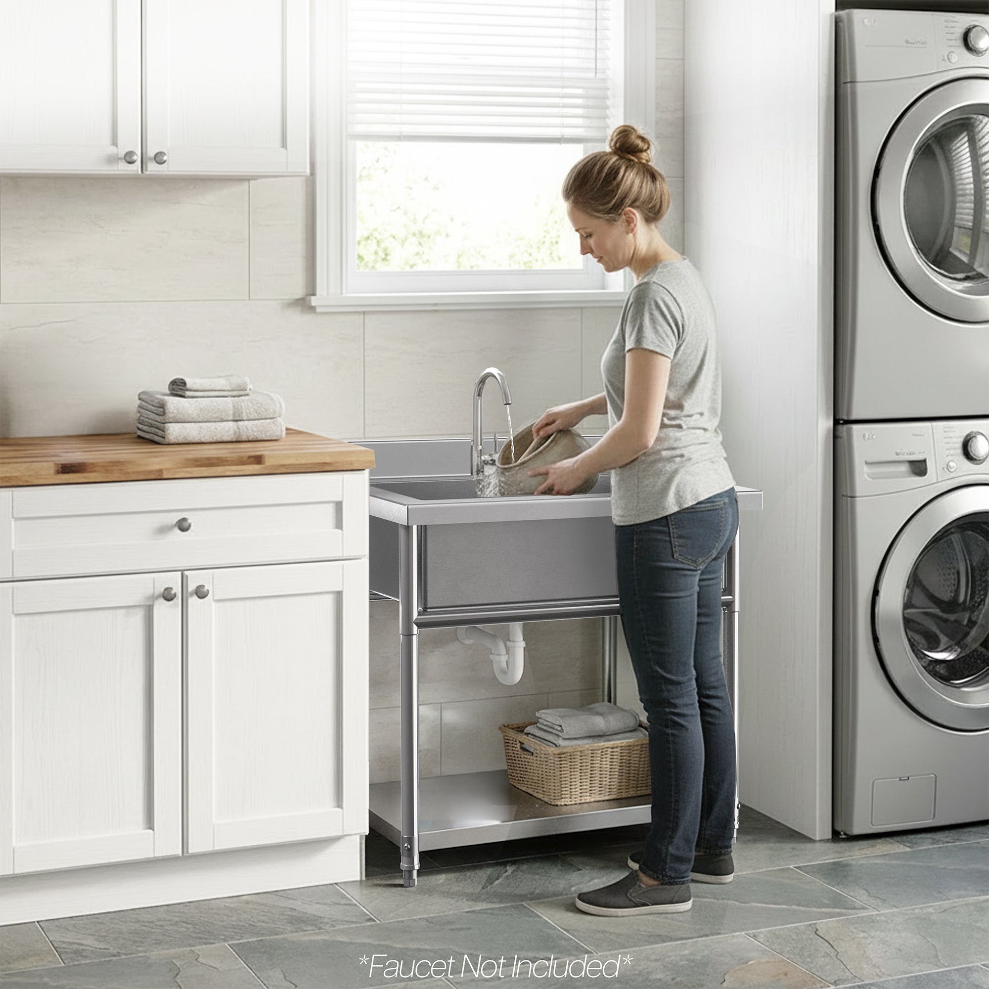 Woman at Stainless Steel Single Bowl Large Utility Sink in a laundry room washing bowl.