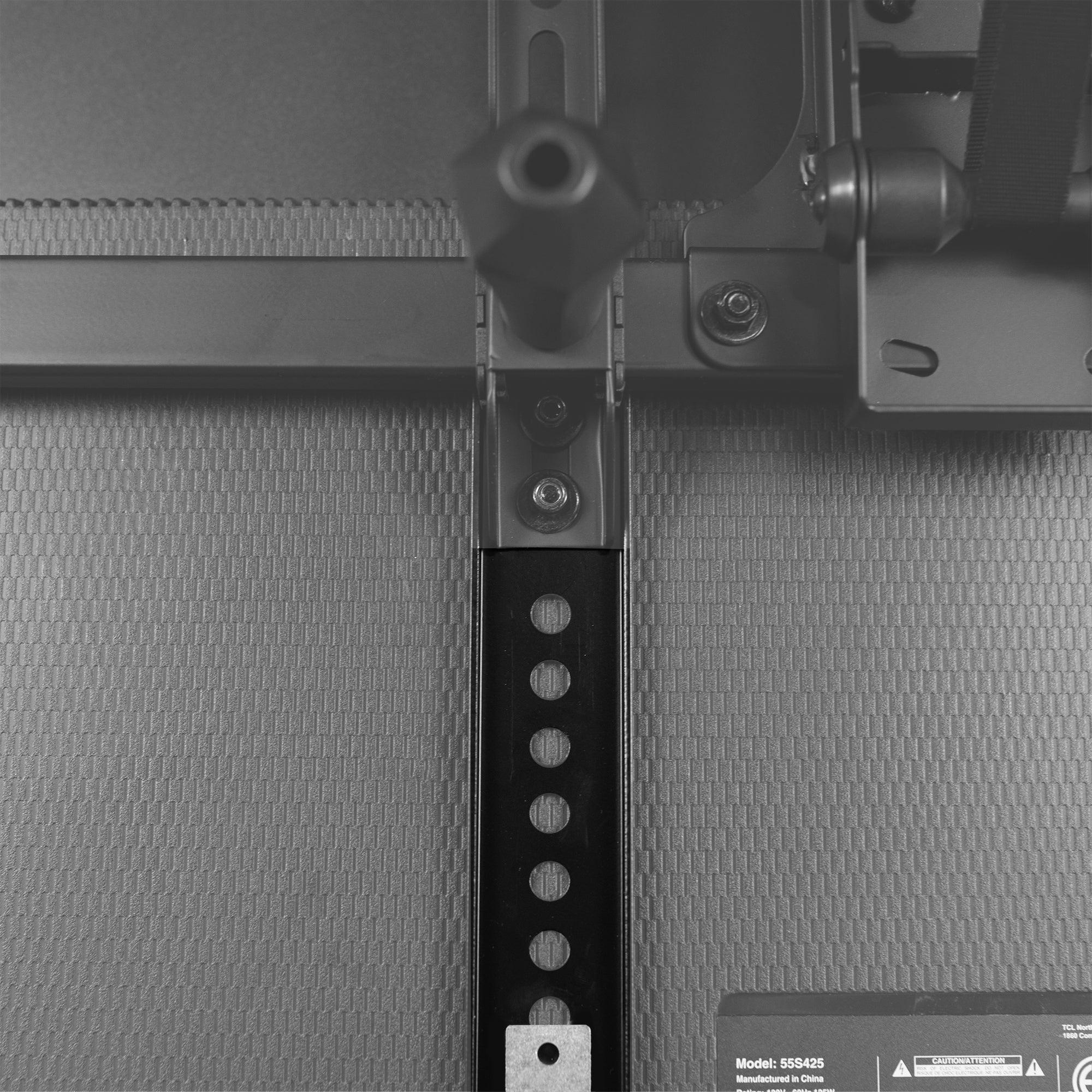 Vertical overhead VESA plate extender brackets.