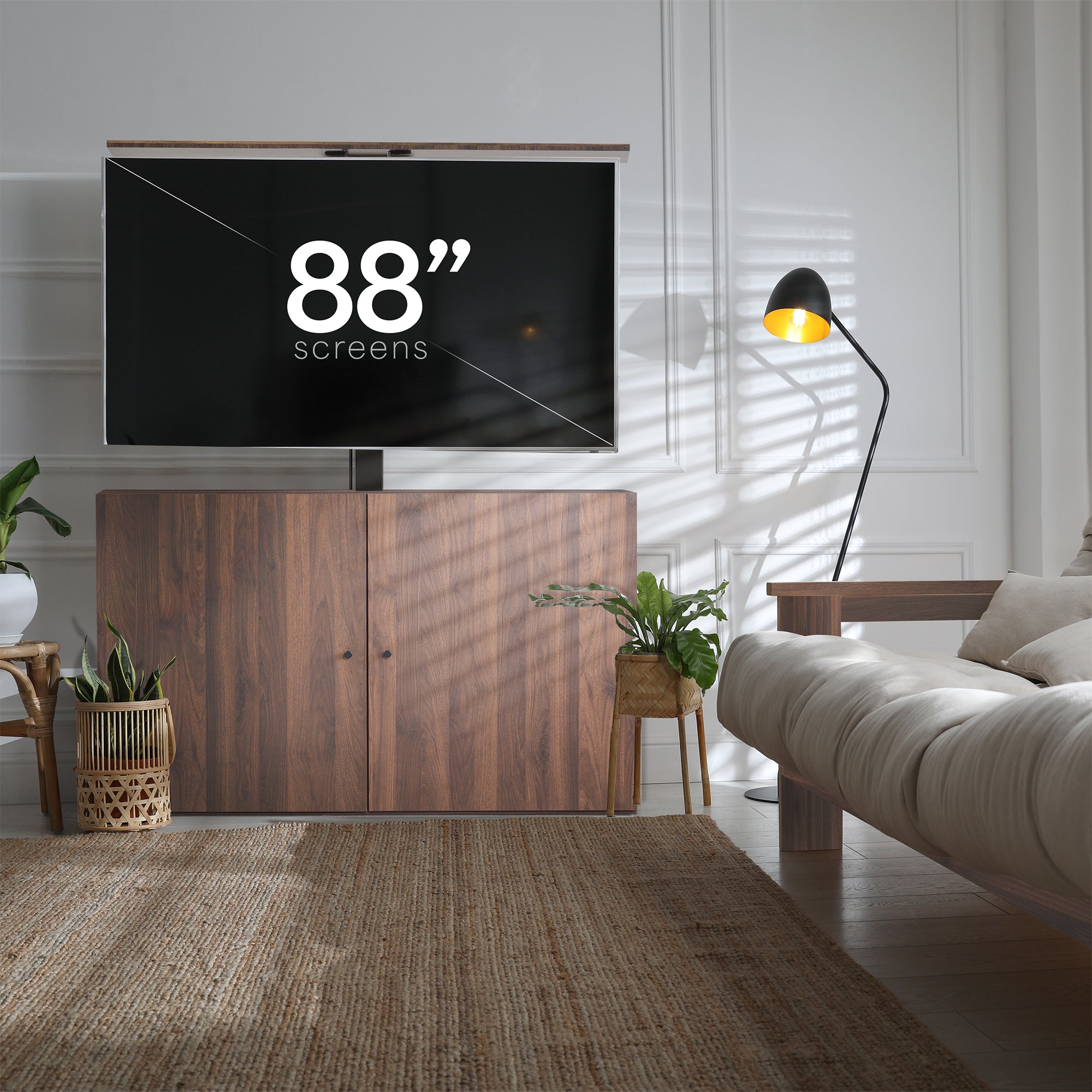 A motorized large TV mount with remote control, showing a flat panel TV attached to a ceiling mount with an extension pole.