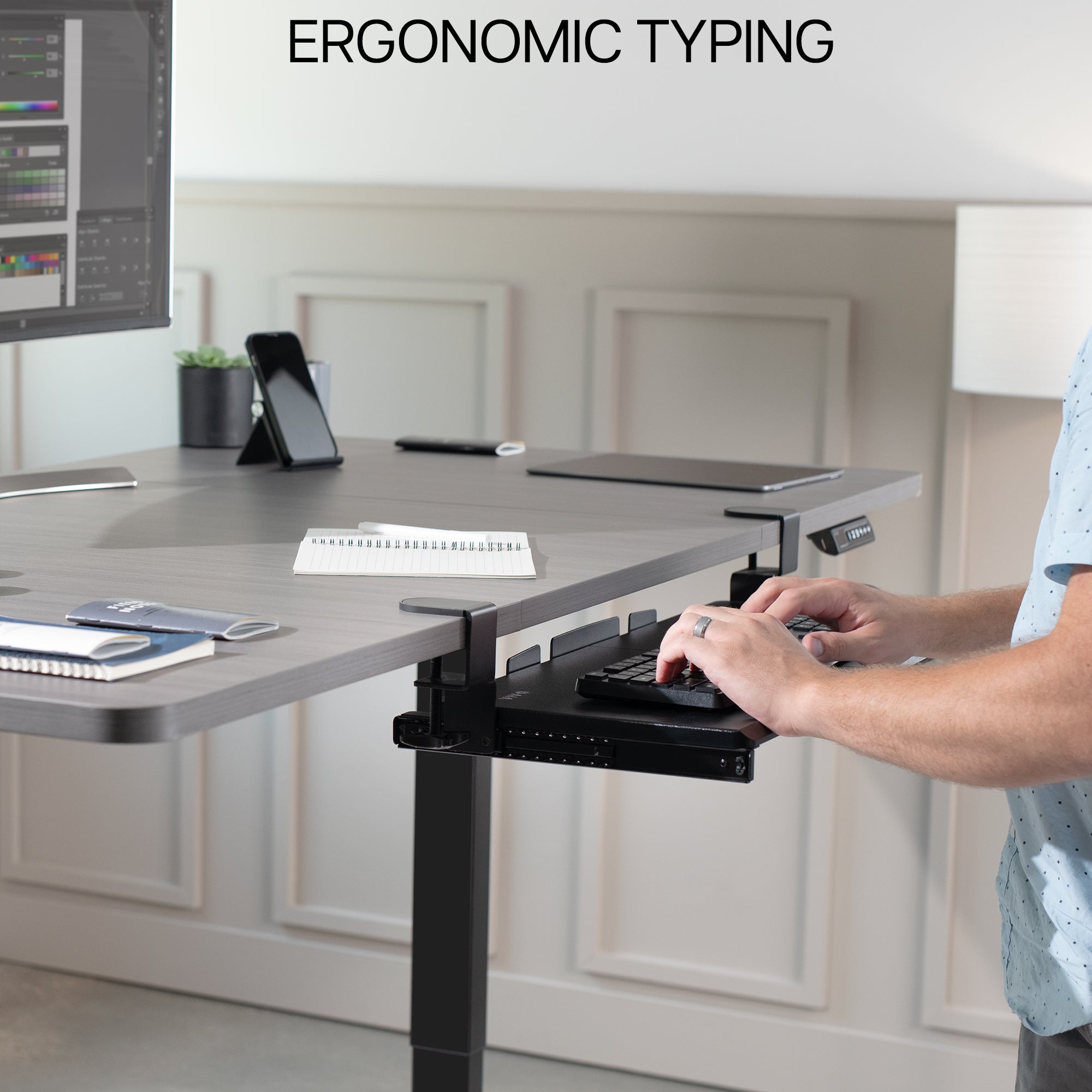Under desk solid steel sliding keyboard tray.