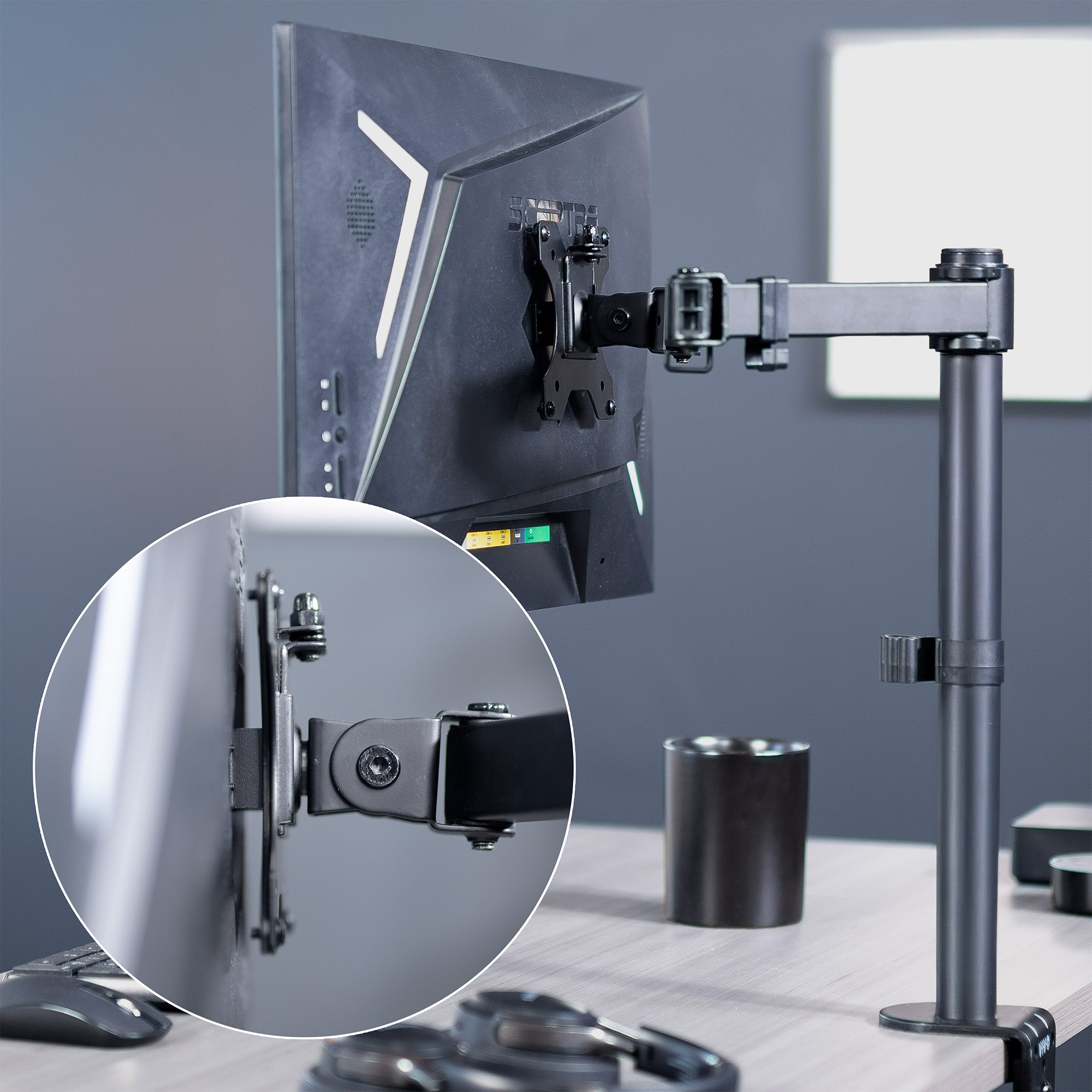 A black VESA adapter designed for compatible Sceptre monitors.