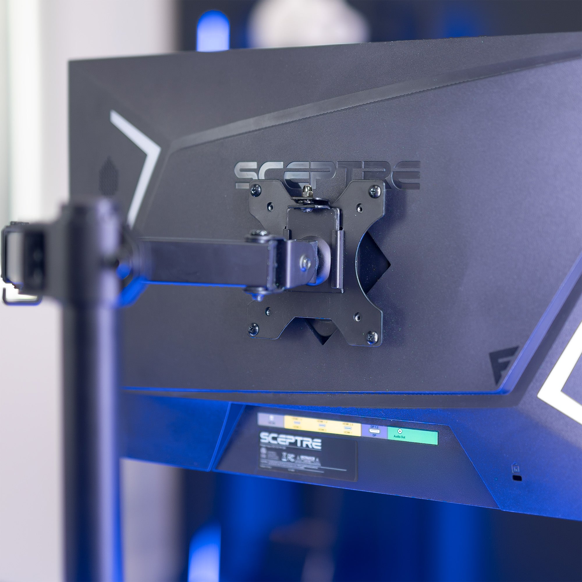 A black VESA adapter designed for compatible Sceptre monitors.