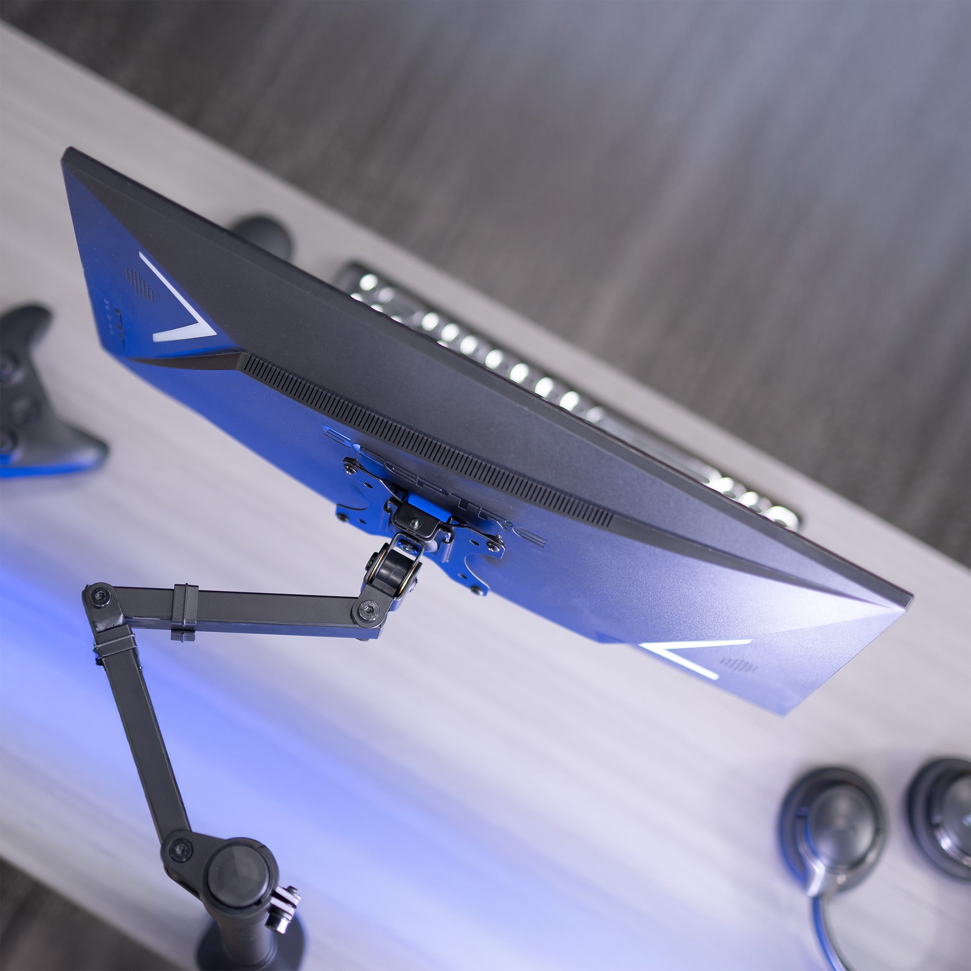 A black VESA adapter designed for compatible Sceptre monitors.