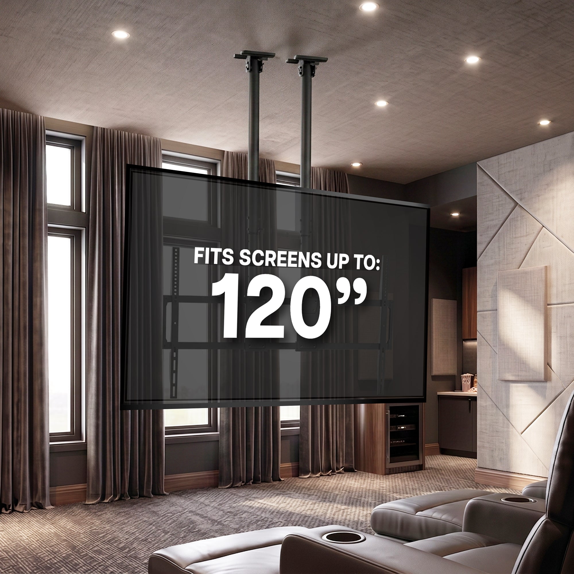 A large black hanging TV display in a modern home theater with gray leather recliners, brown curtains, and ceiling lights. White text on the screen reads 'FITS SCREENS UP TO: 120"'.