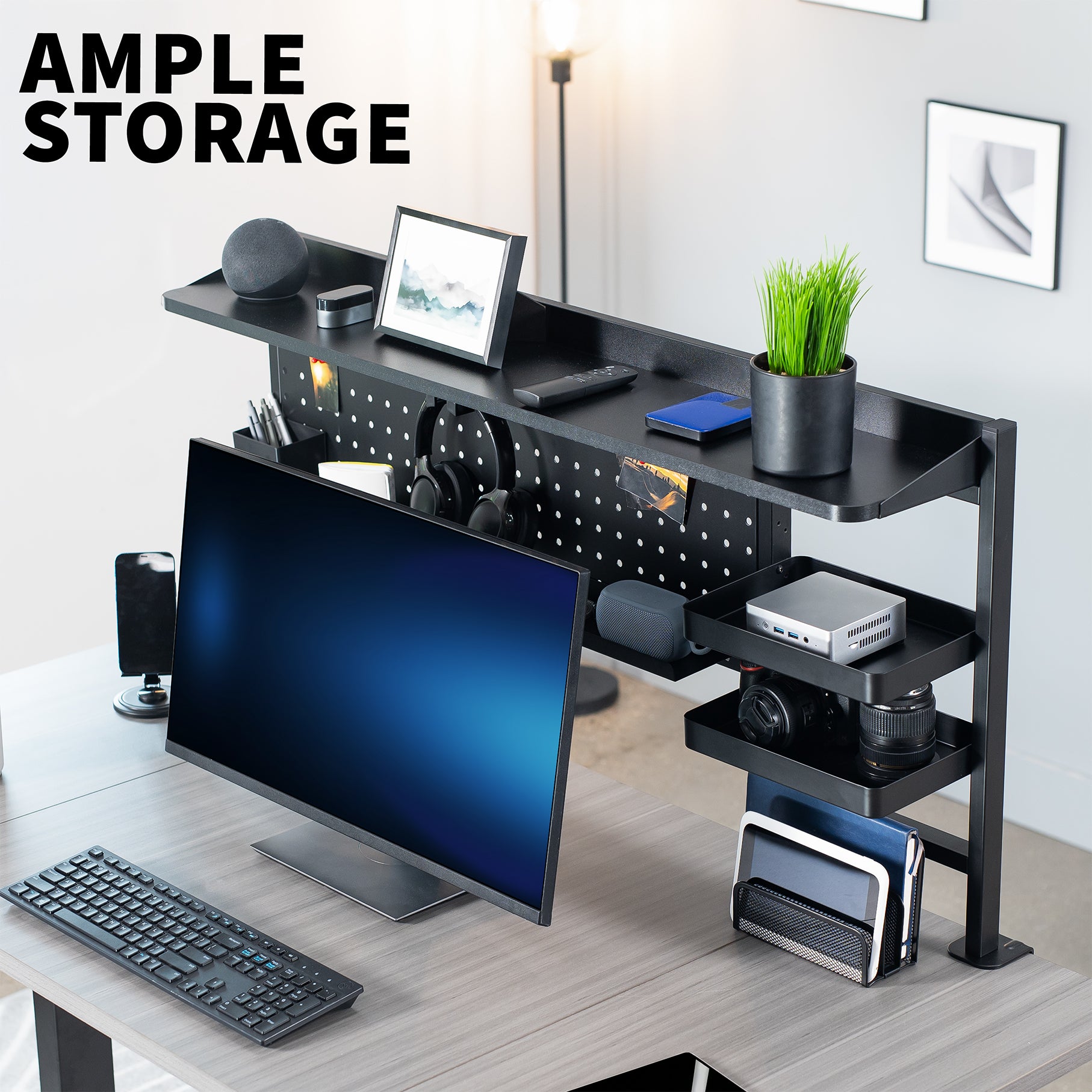 Black office desk with computer setup and ample storage space.