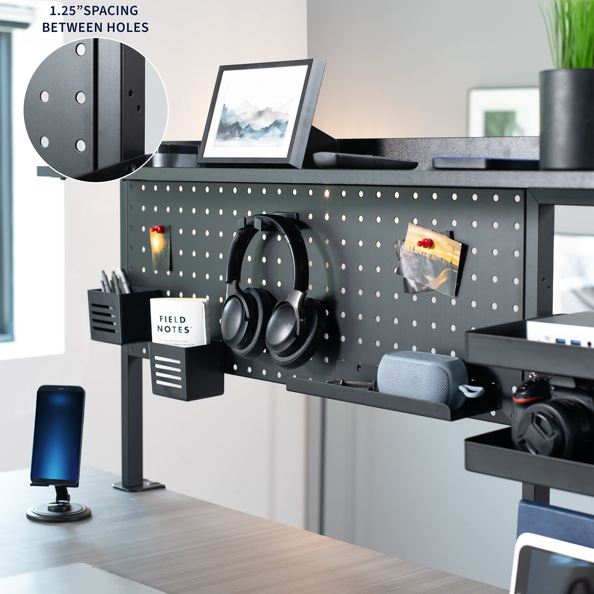 Black office desk with computer setup and ample storage space.