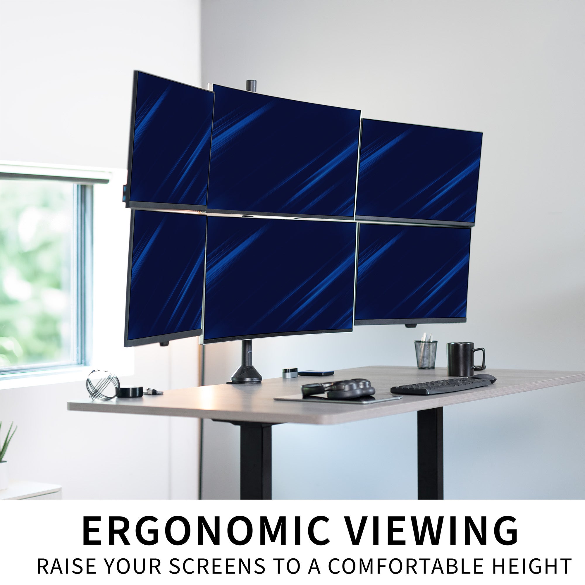Multiple computer monitors on a desk.