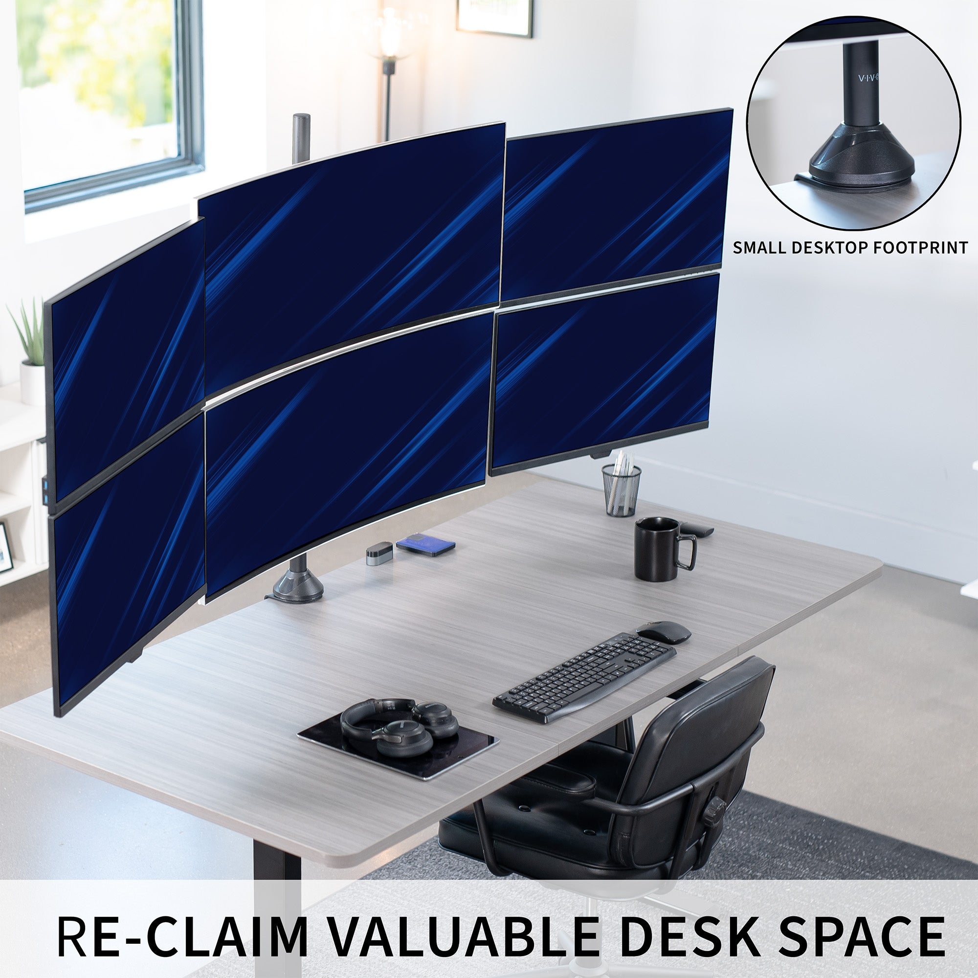 Multi-monitor setup on a desk with a small desktop footprint, featuring a chair and office accessories.