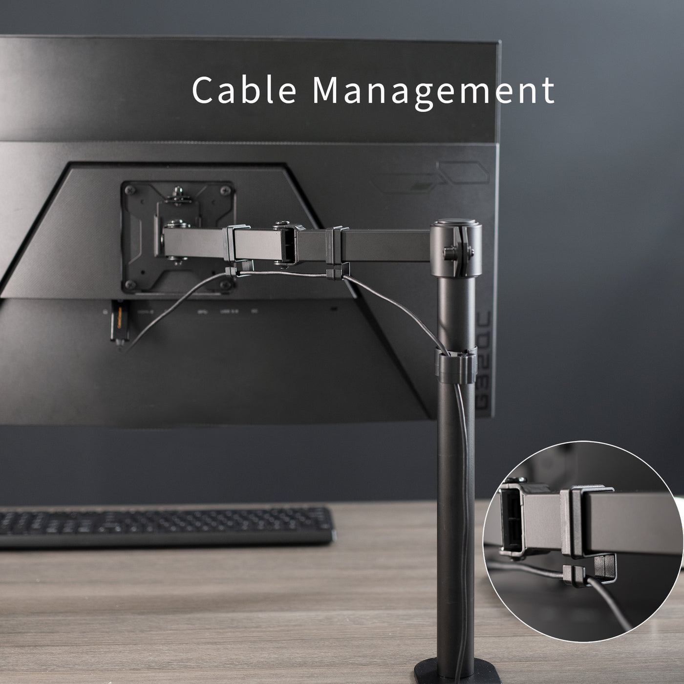 Cable management is provided along the arm and pole of the mount to maintain a tidy workspace.