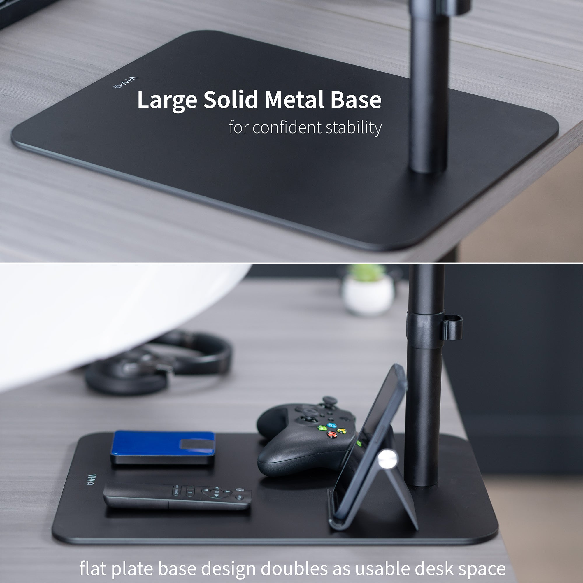 Black desk setup with large solid metal base and flat plate design on a desk.