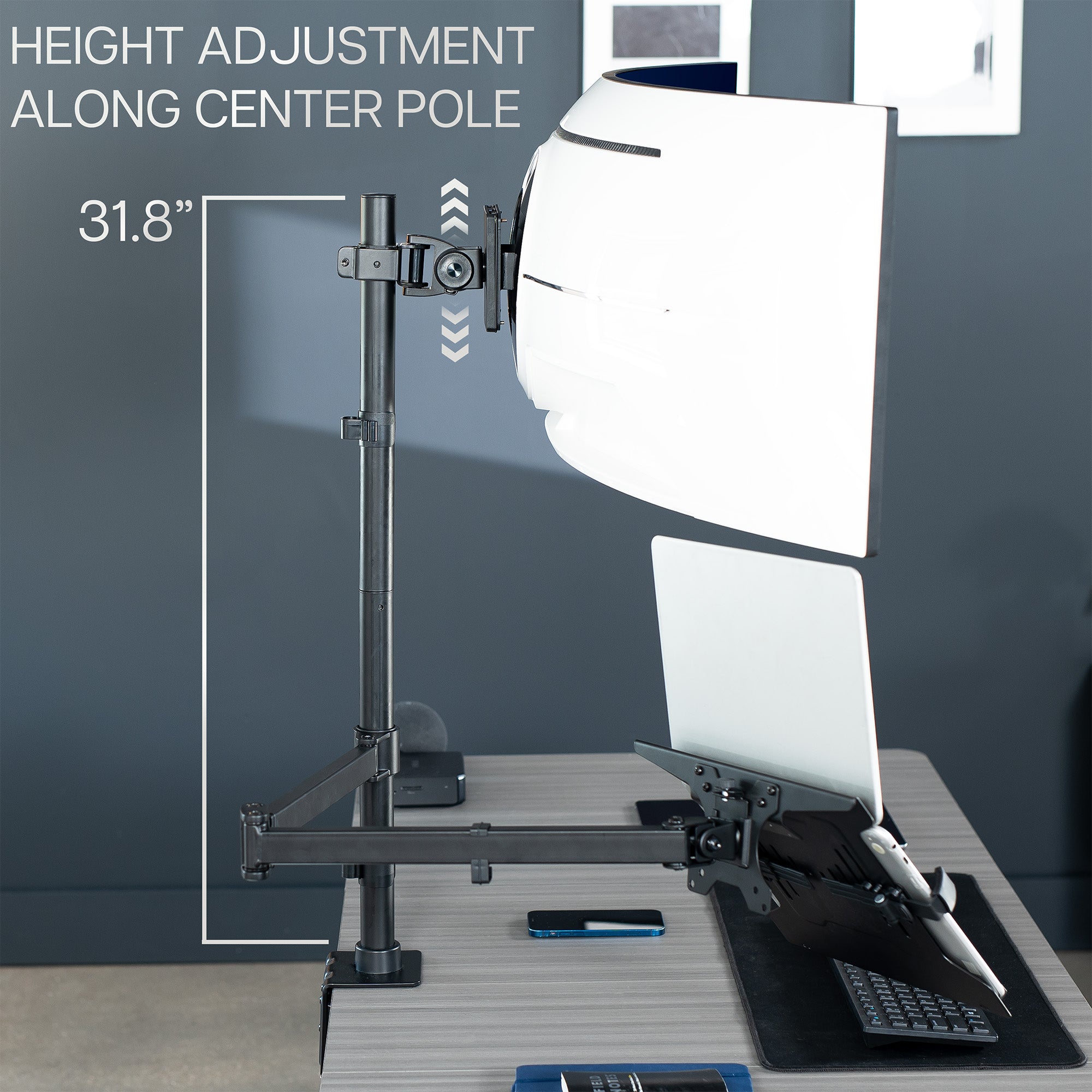 Laptop on a height-adjustable mount with softbox light above, on a desk.