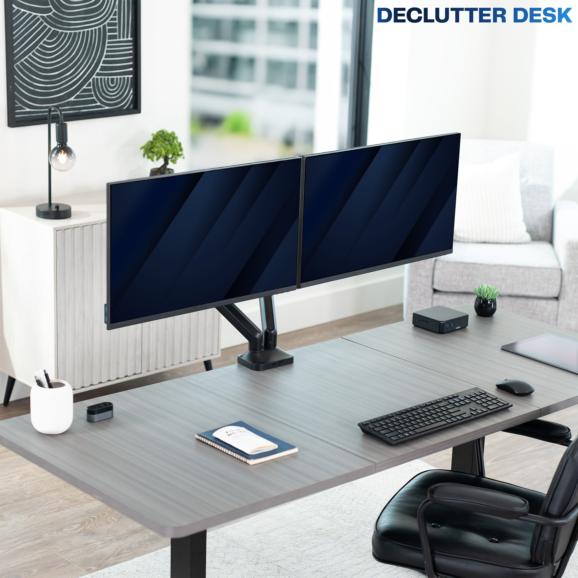 Modern home office setup with a desk, dual monitors, and office chair.