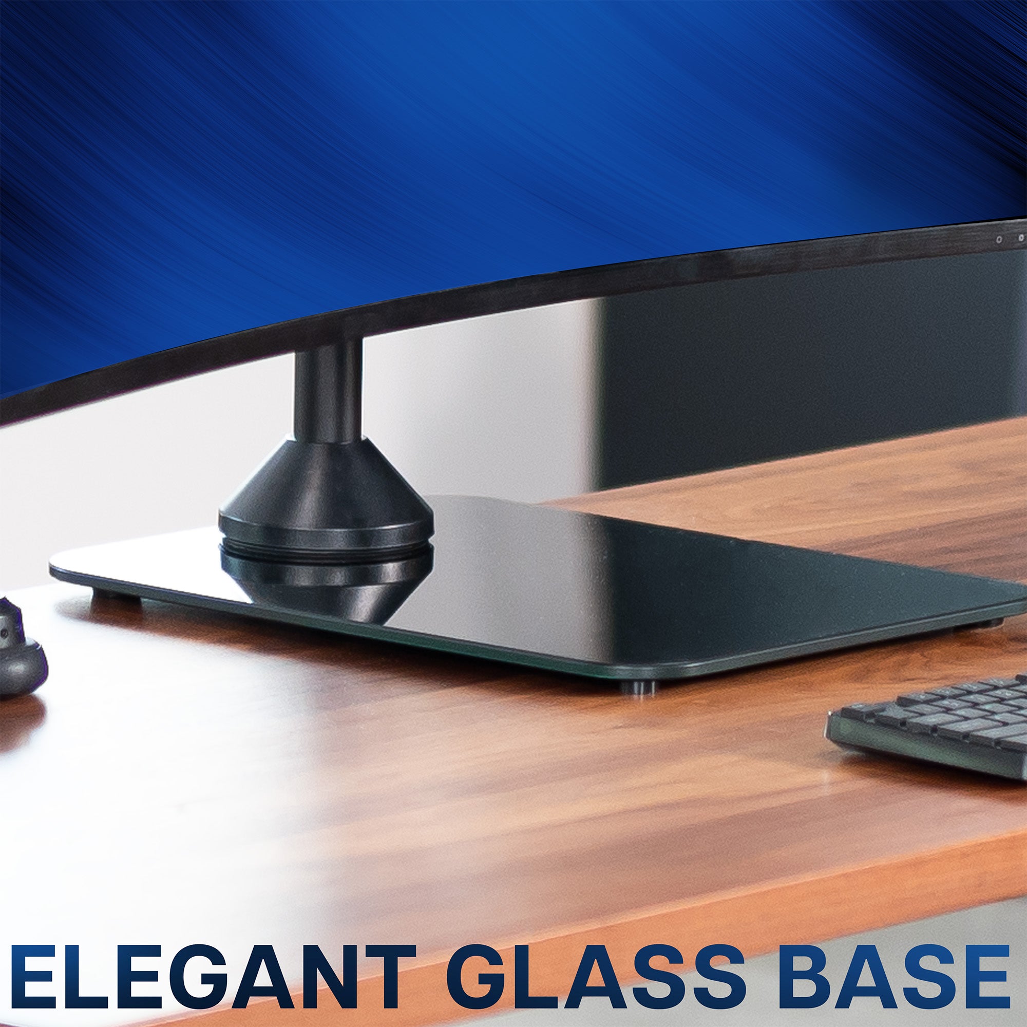 Computer monitor with an elegant glass base on a wooden desk