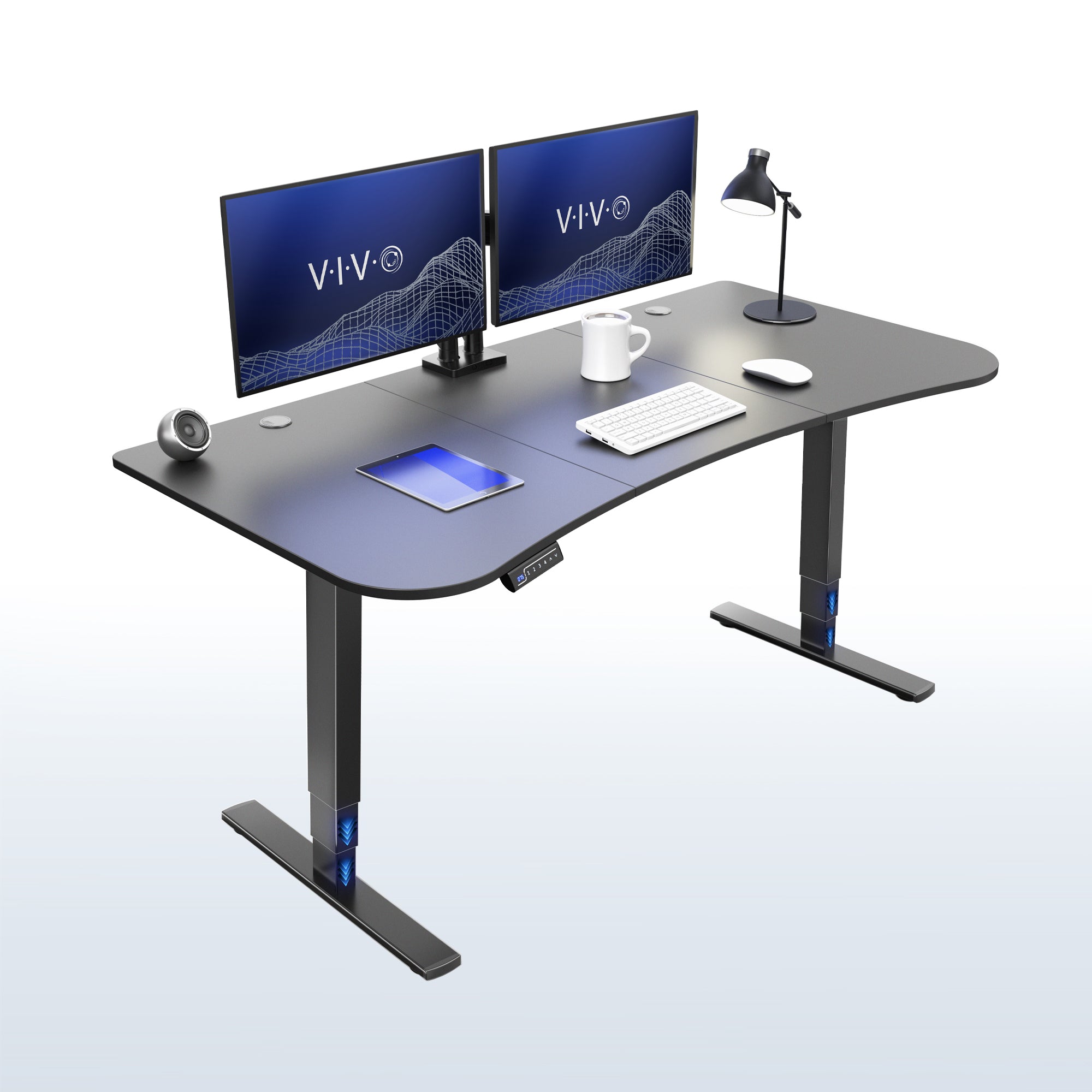 63” x 32” Electric Height Adjustable Stand Up Desk. Features a built-in power strip.
