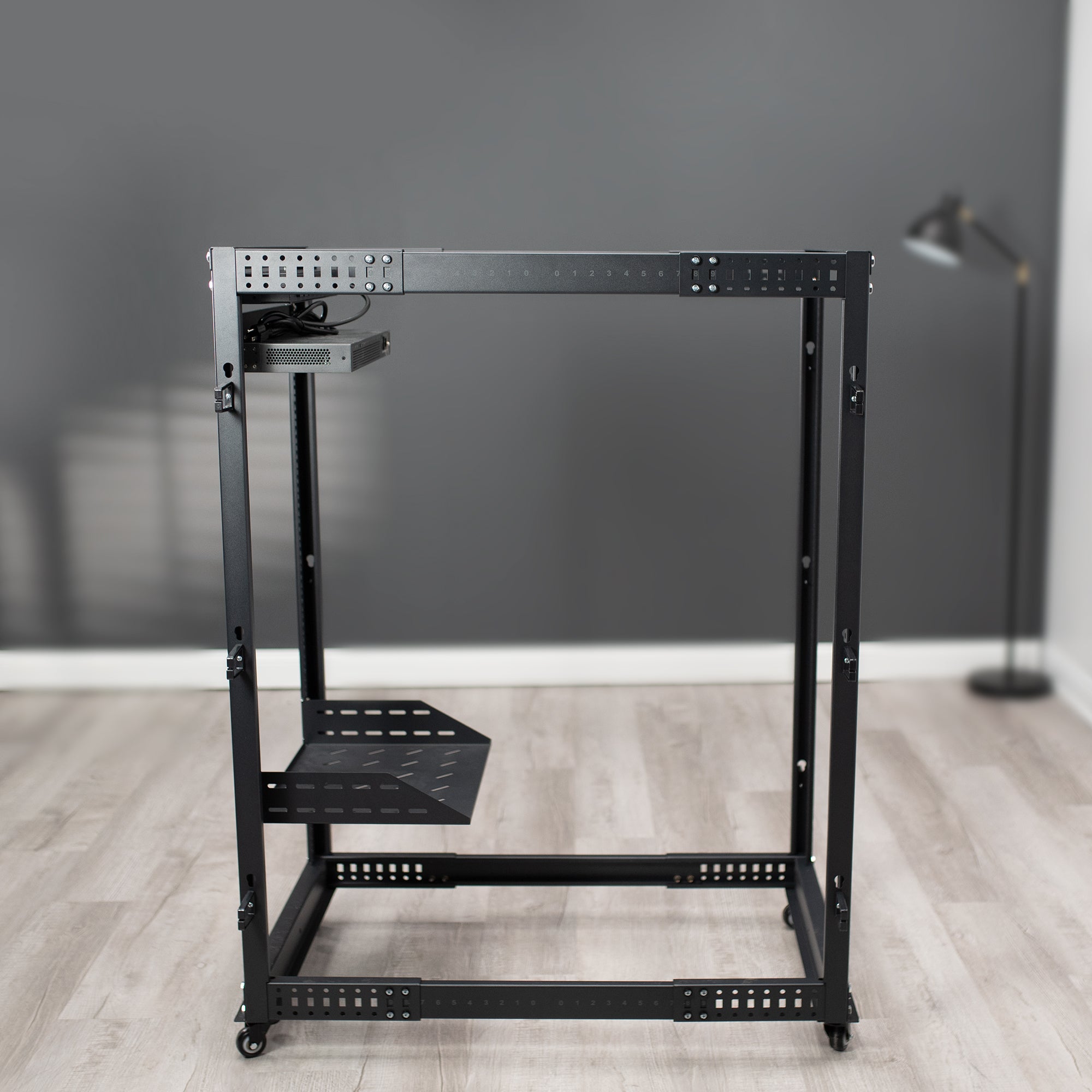 Black network rack with multiple ports.