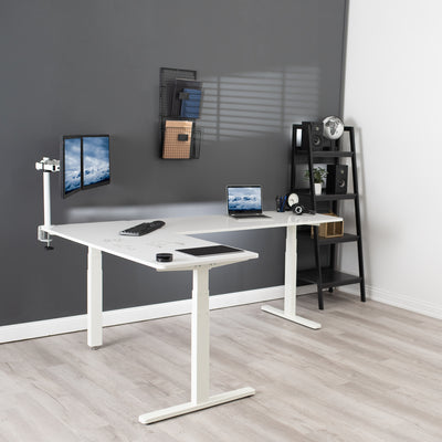Large sturdy height adjustable corner desk workstation with dry erase surface and memory controller.