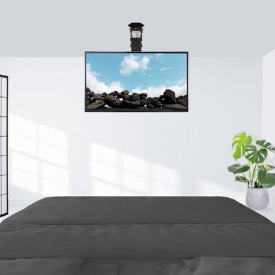 Electric television mounted on a flat bedroom ceiling for easy viewing.