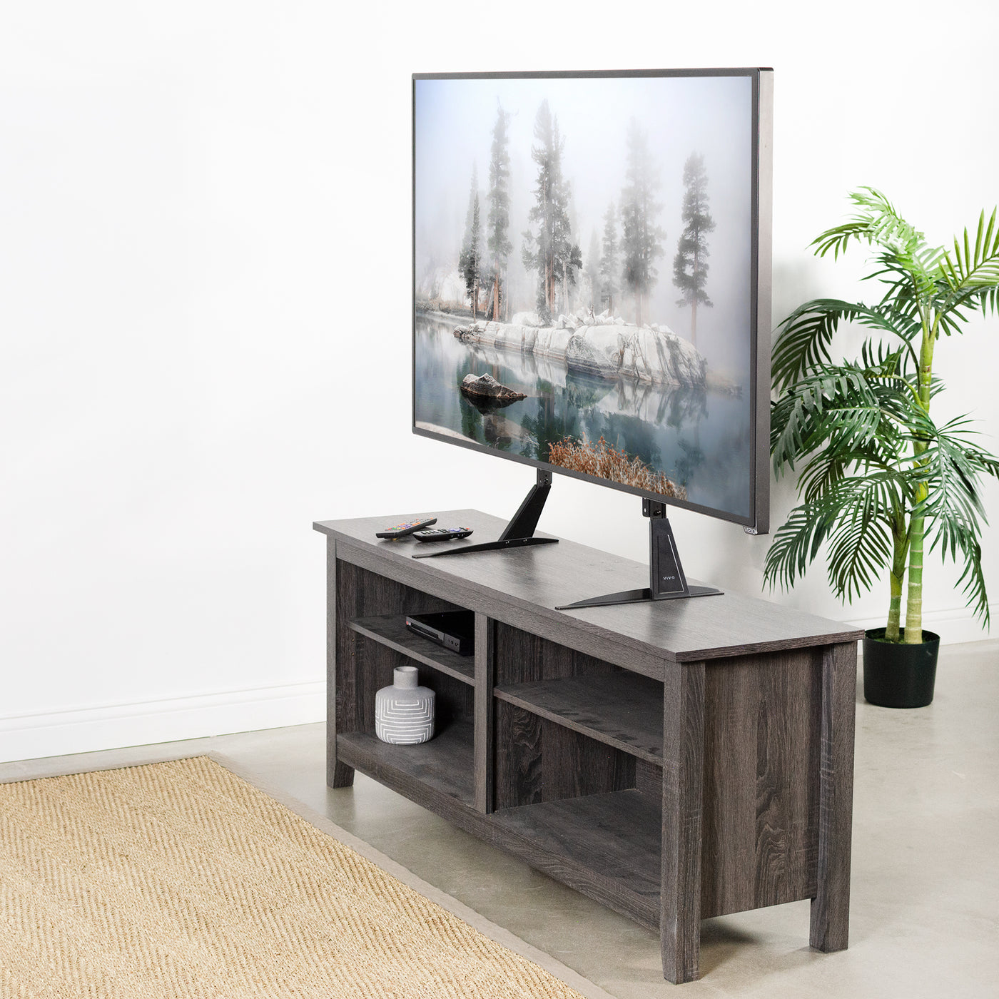  Minimalist and sleek looks of dual-leg TV stands.