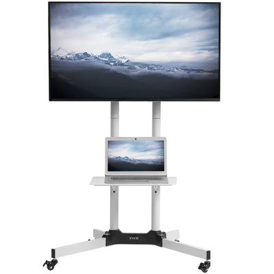 White mobile and height adjustable TV mount with tray for laptop.