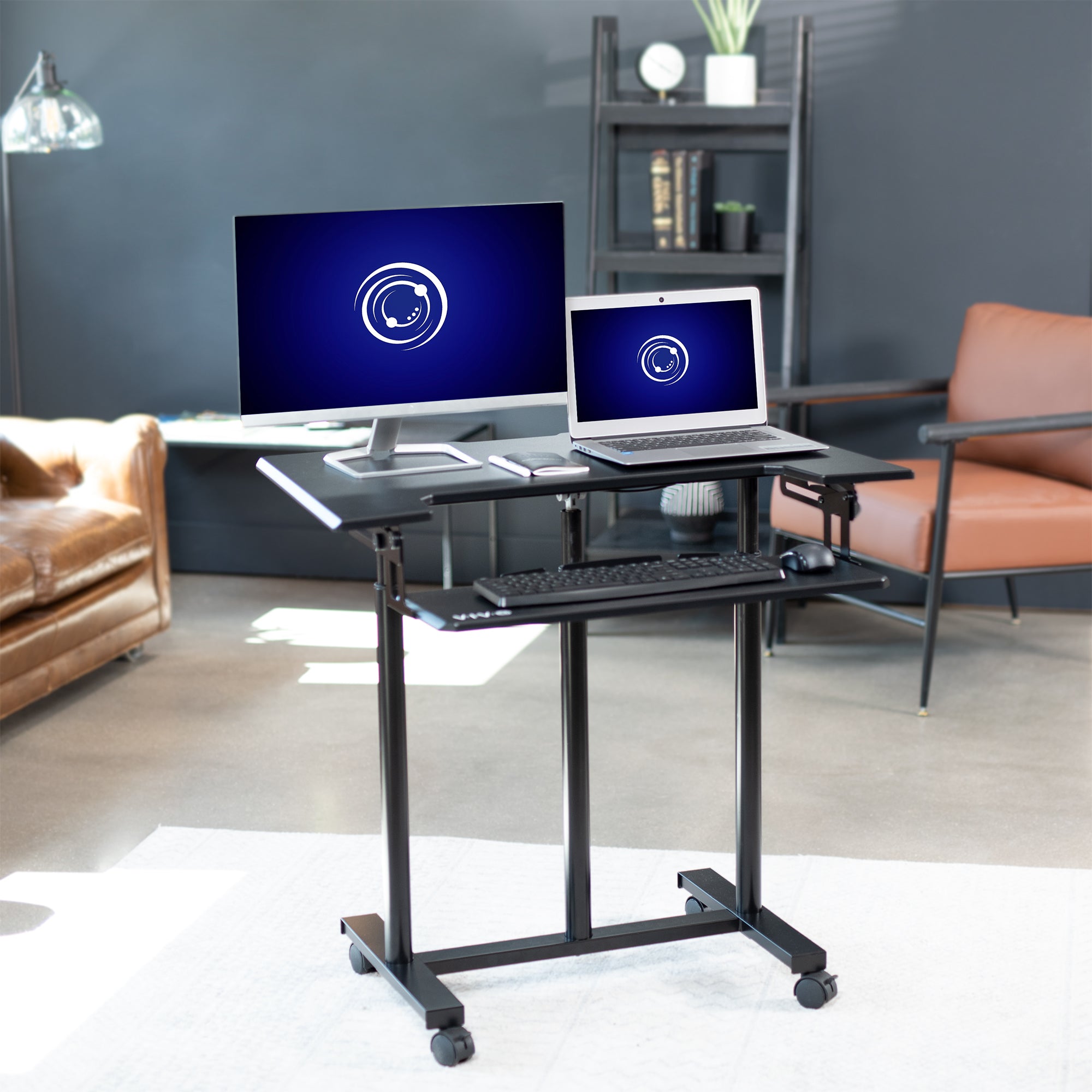 Ergonomic mobile adjustable computer workstation cart.