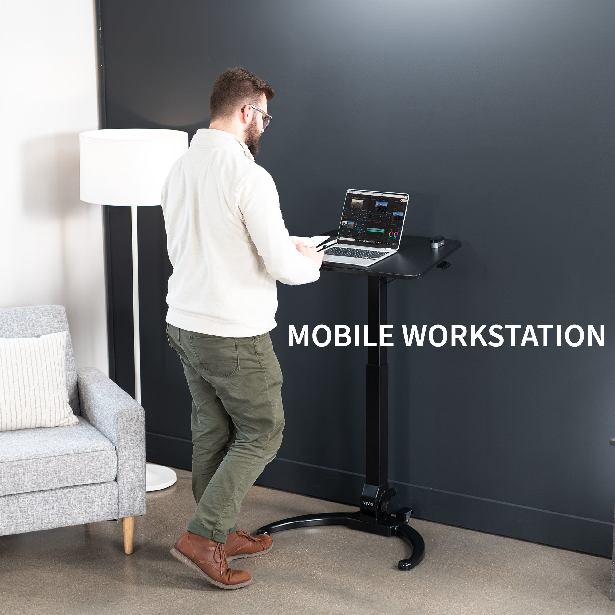 Sleek mobile foldable laptop desk with height adjustment and tilt. Can fold away to store behind furniture.