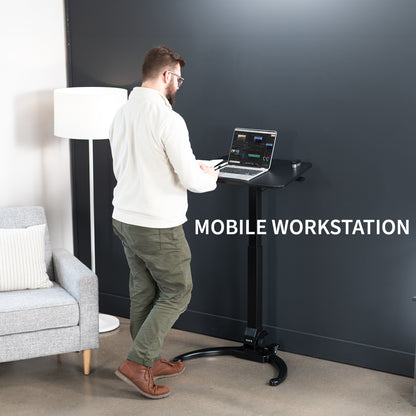 Sleek mobile foldable laptop desk with height adjustment and tilt. Can fold away to store behind furniture.