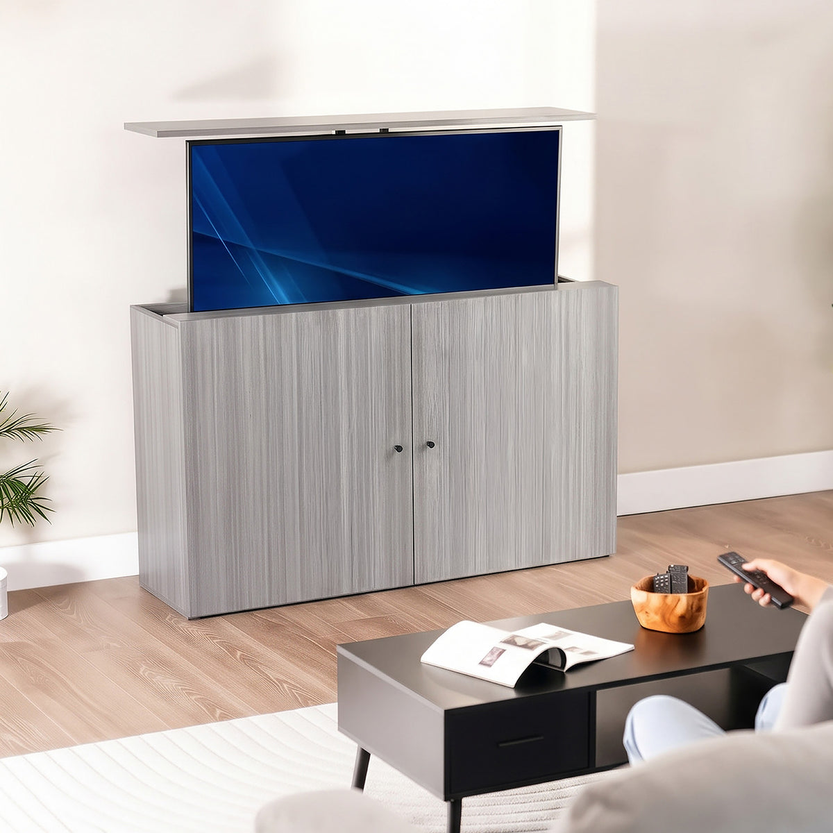 Modern living room with a gray TV cabinet concealing the TV.