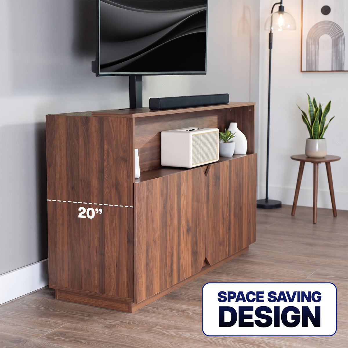 A walnut wood TV stand in a modern living room setting, featuring a 20-inch height dimension overlay and a 'SPACE SAVING DESIGN' badge. The stand includes open shelving on top, a lower cabinet section with two doors, and is styled with a television, soundbar, speaker, and decorative vases.