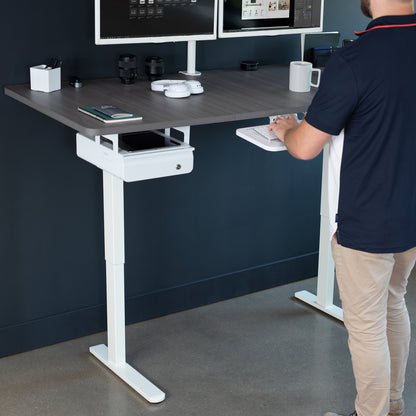 Electric sit-to-stand desk frame with rear set legs.