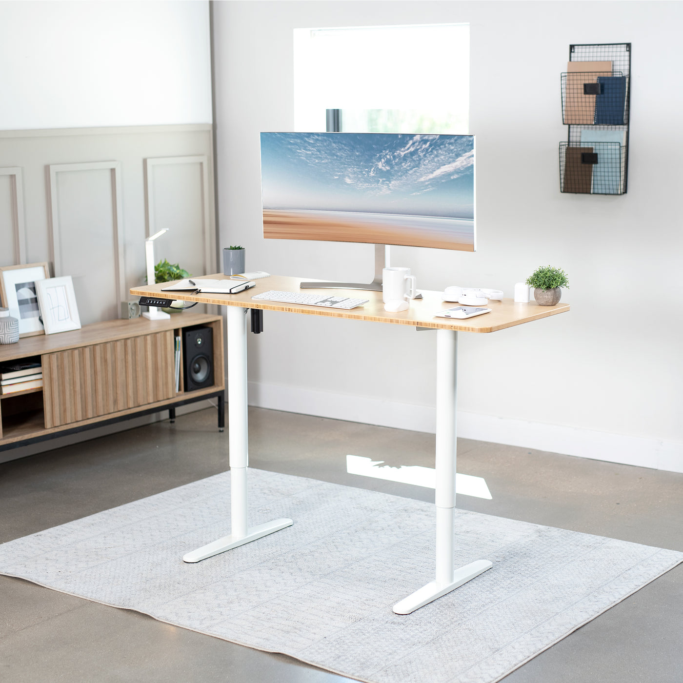 Sturdy ergonomic sit or stand desk frame for active workstation with adjustable height using smart control panel.