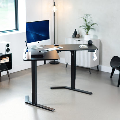 Large heavy-duty electric height adjustable corner desk workstation for active sit or stand efficient workspace.